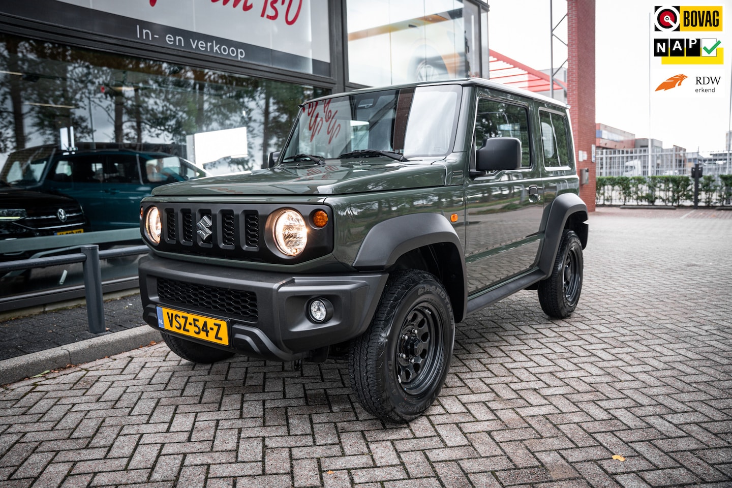 Suzuki Jimny - 1.4 4wd | Airco | Cruise | Stoelverwarming | Lane departure warning | Grijs kent. | Trekha - AutoWereld.nl
