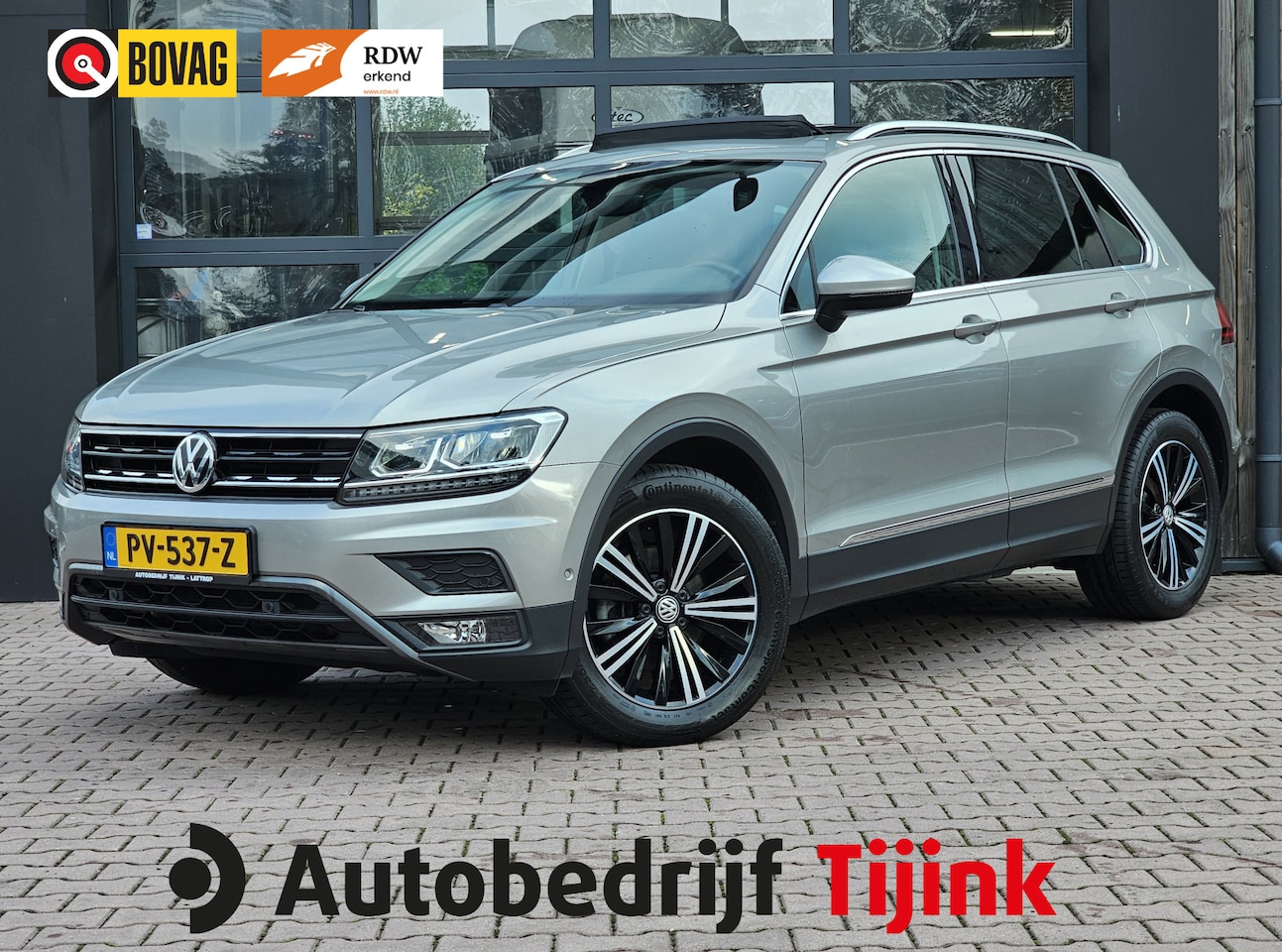Volkswagen Tiguan - 1.4 TSI 4MOTION Highline | Pano | Trekhaak | LED | Stoelverwarming | Leder | Elek. stoelen - AutoWereld.nl