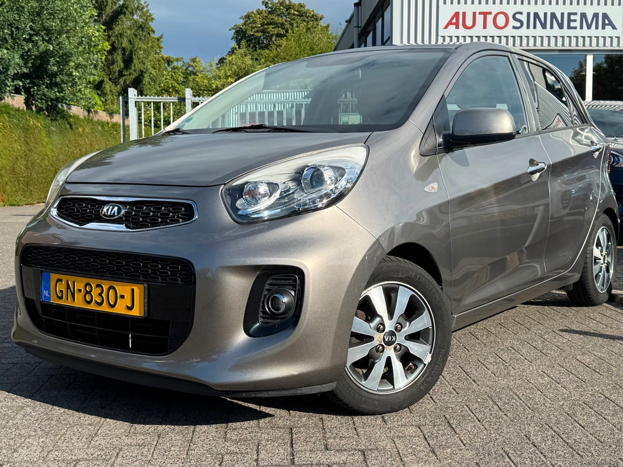 Kia Picanto - 1.0 CVVT First Edition | All Season | Trekhaak | Climate Control | - AutoWereld.nl