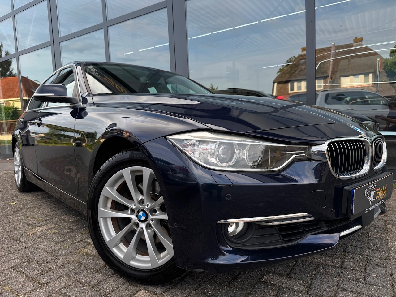 BMW 3-serie - 320i High Executive | Leer | Open dak - AutoWereld.nl