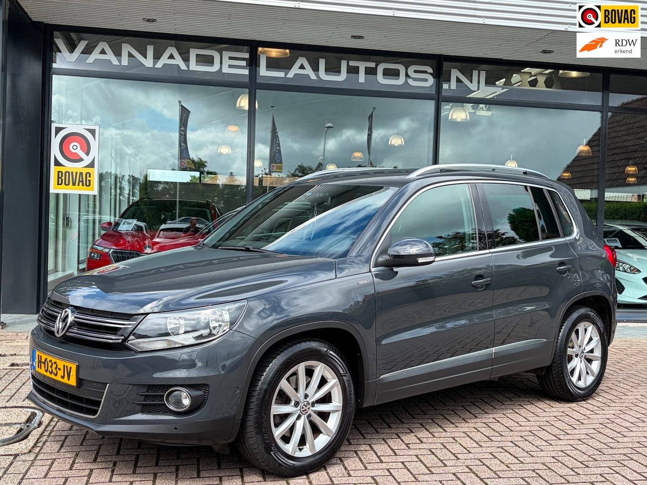 Volkswagen Tiguan - 1.4 TSI R-Line Navi Camera Clima Cruise Trekhaak Volledig Dealeronderhouden! - AutoWereld.nl