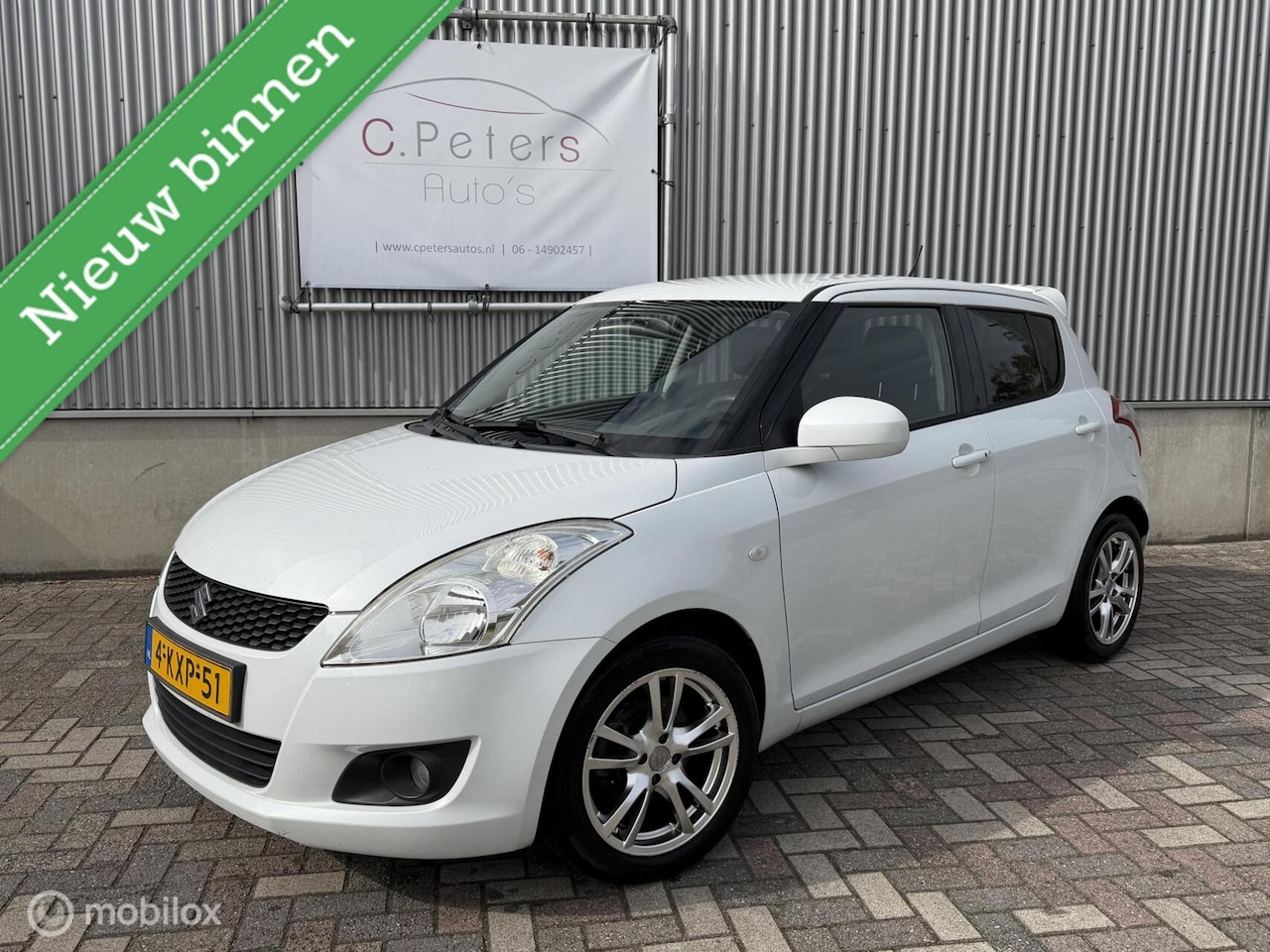 Suzuki Swift - 1.2 Bandit EASSS 2013 / Climate / Cruisecontrol / Keyless / Stoelverwarming / Wit metallic - AutoWereld.nl