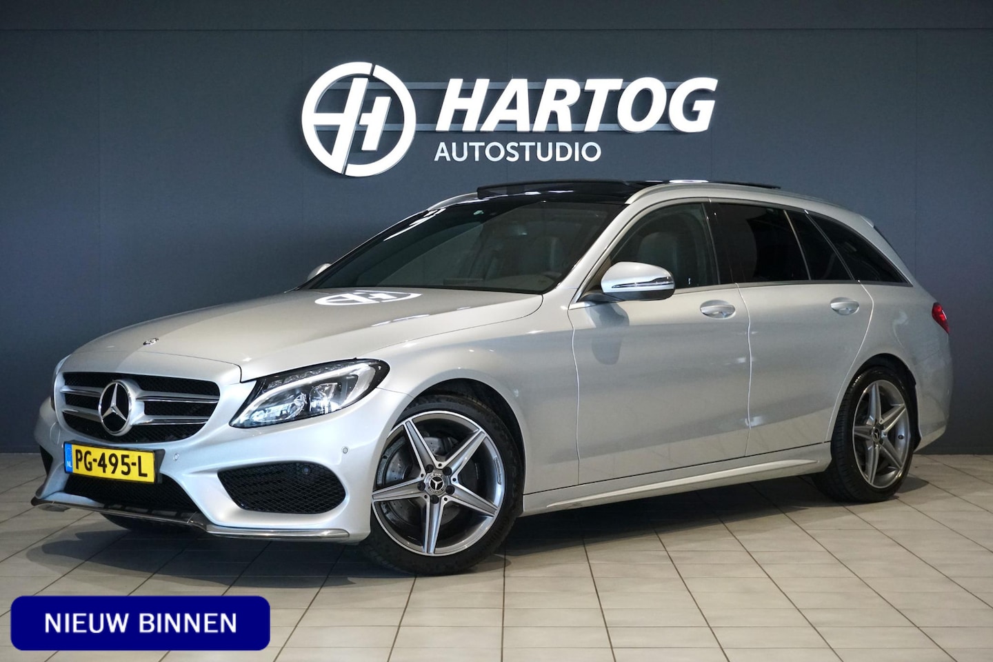 Mercedes-Benz C-klasse Estate - 180 Business Solution AMG + CAMERA / PANO / DODEHOEK / NAVI / LEDER - AutoWereld.nl