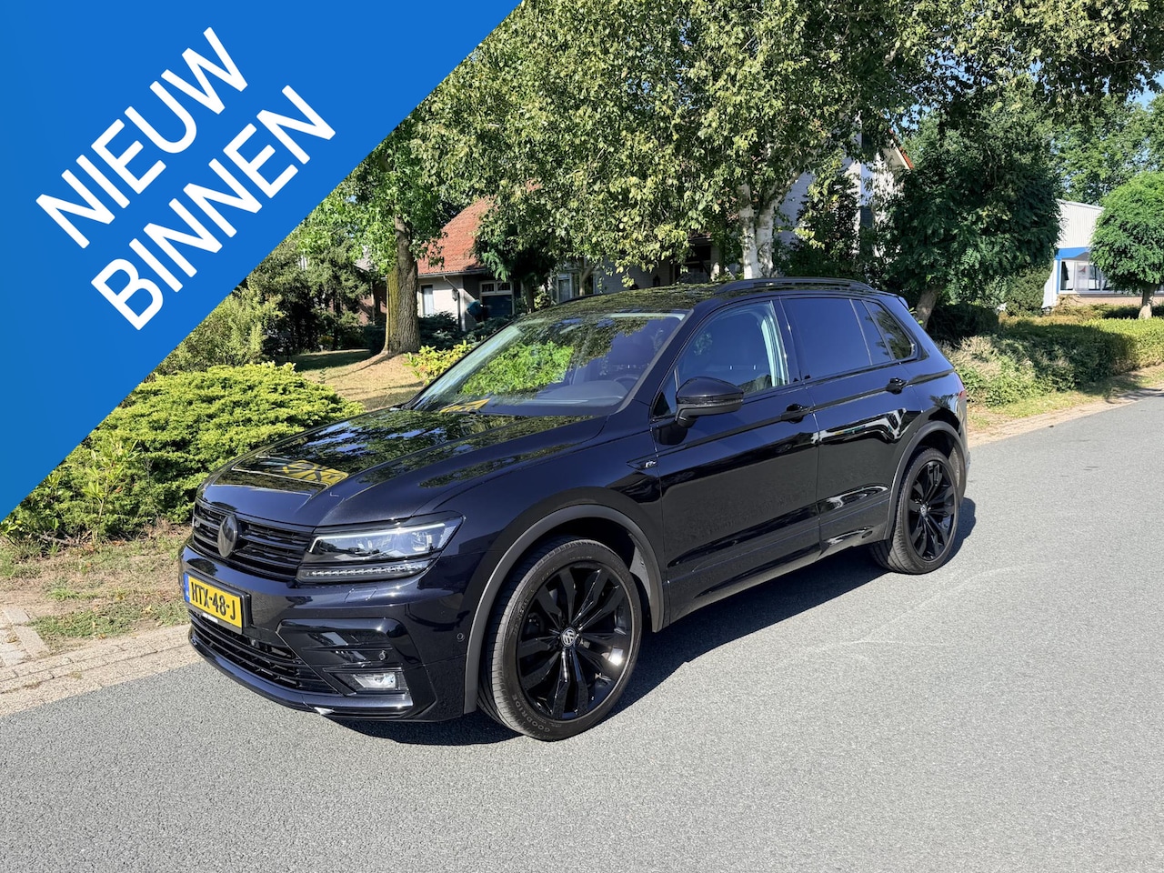Volkswagen Tiguan - 2.0 TSI 4Motion 220PK DSG R-Line•Pano•Trekhaak - AutoWereld.nl