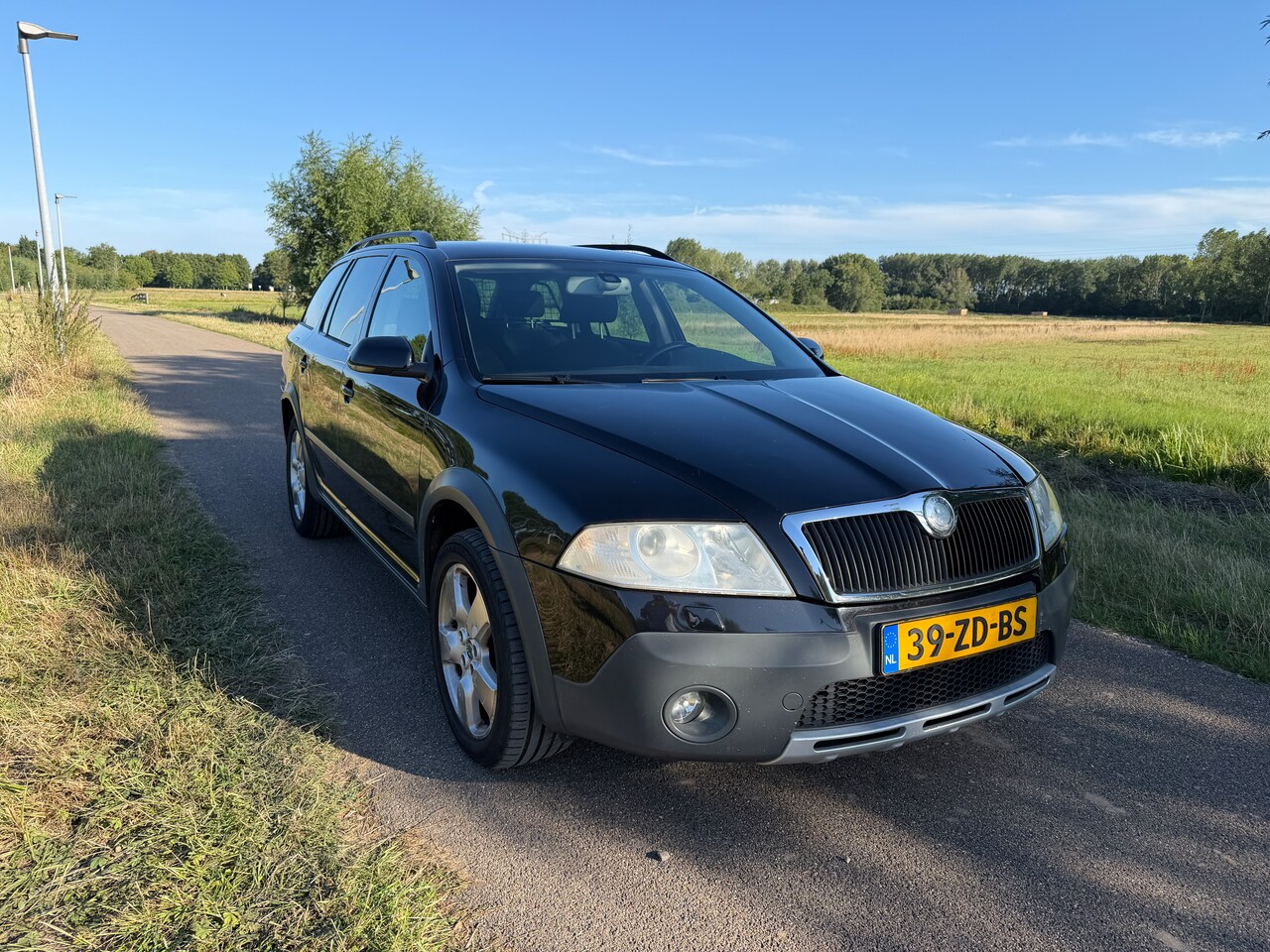 Skoda Octavia Combi - 2.0 TDI Scout 4x4 UNIEK - AutoWereld.nl
