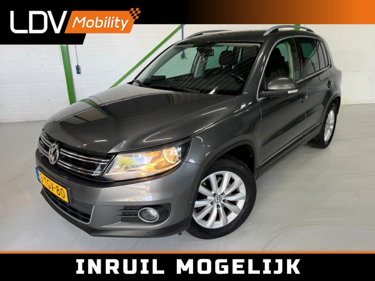 Volkswagen Tiguan - 1.4 TSI Sport en Style / Trekhaak / Park assist / PCD Voor en Achter / Navi / Bluetooth / - AutoWereld.nl