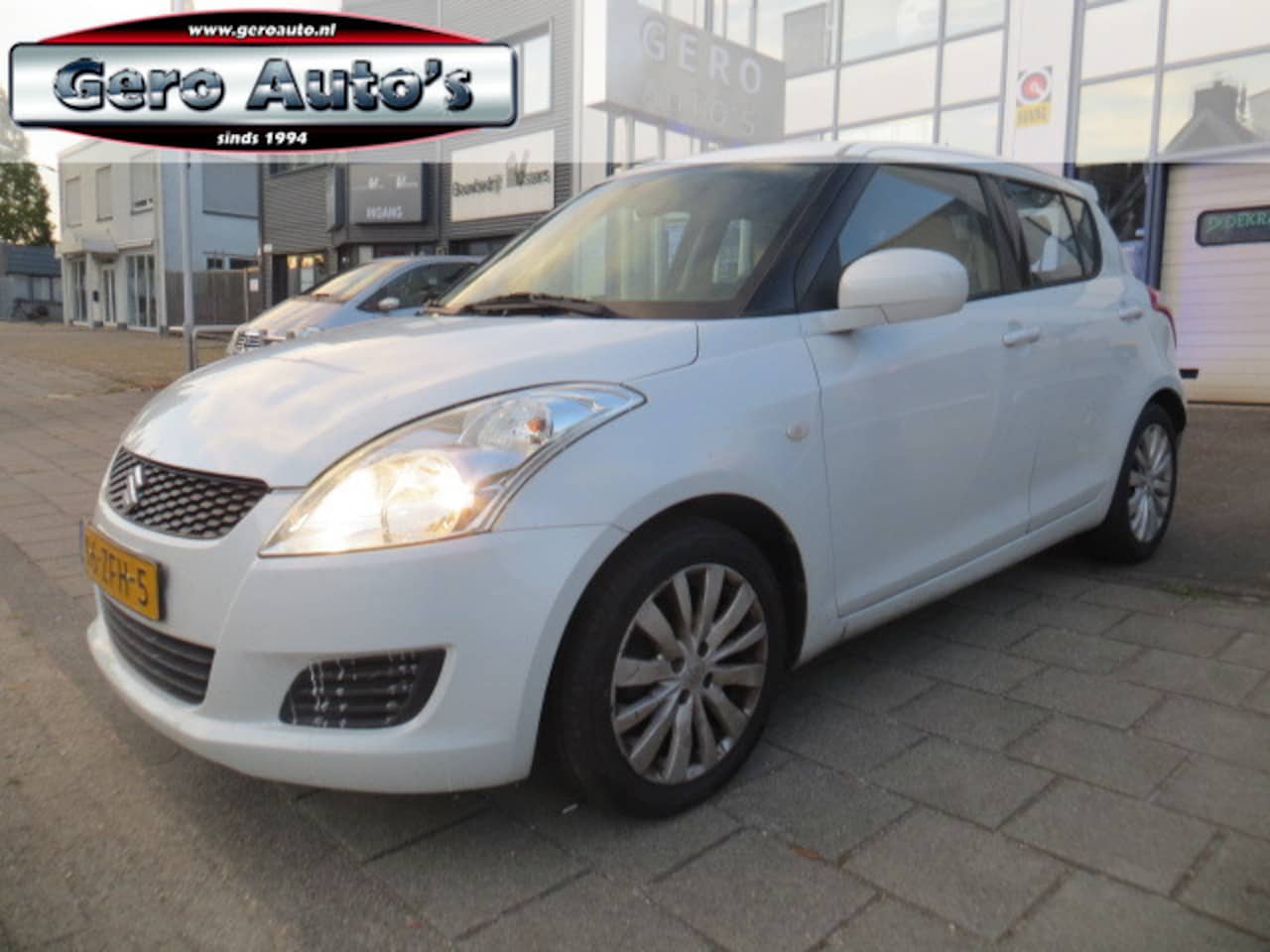 Suzuki Swift - 1.2 Bandit EASSS cruise control airco 5 drs - AutoWereld.nl