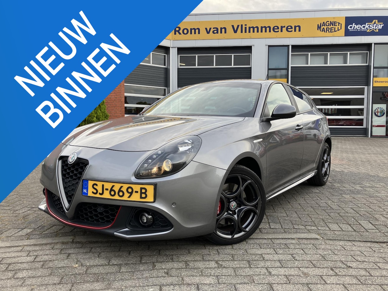 Alfa Romeo Giulietta - 1.4 Turbo MultiAir Super | Rood lederen bekleding | Grigio Magnesio | Trekhaak | - AutoWereld.nl
