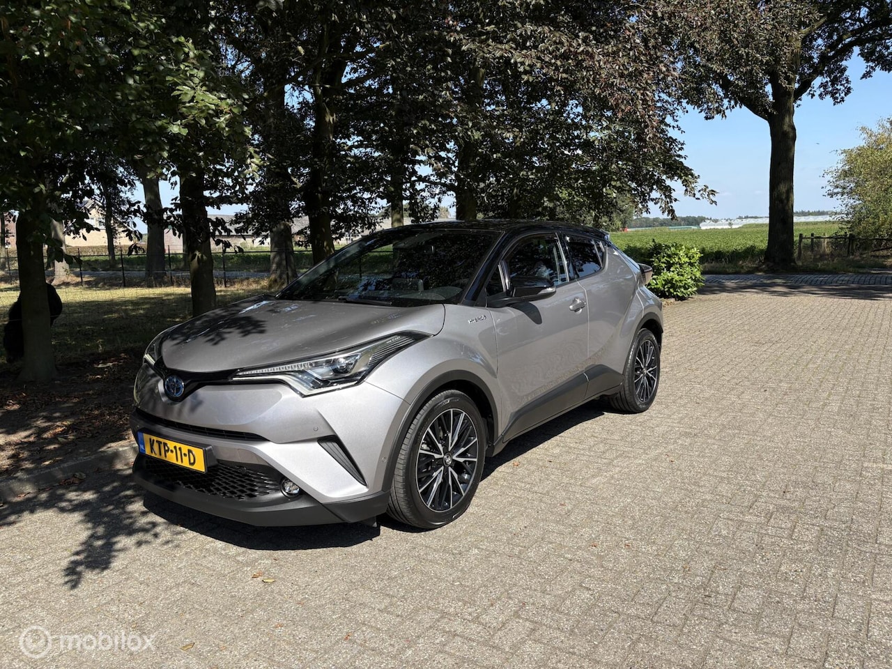 Toyota C-HR - 1.8 Hybrid Bi-Tone JBL Keyless all in rijklaar - AutoWereld.nl