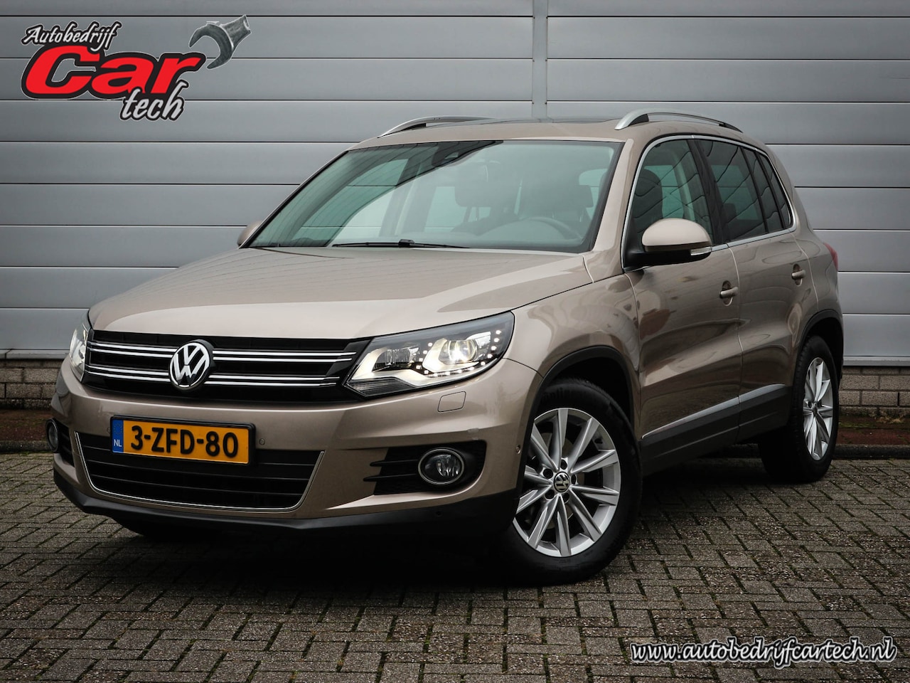 Volkswagen Tiguan - 1.4 TSI Sport&Style | Clima | Cruise | Navi | Leer | Panoramadak | Trekhaak | Xenon | Pdc - AutoWereld.nl