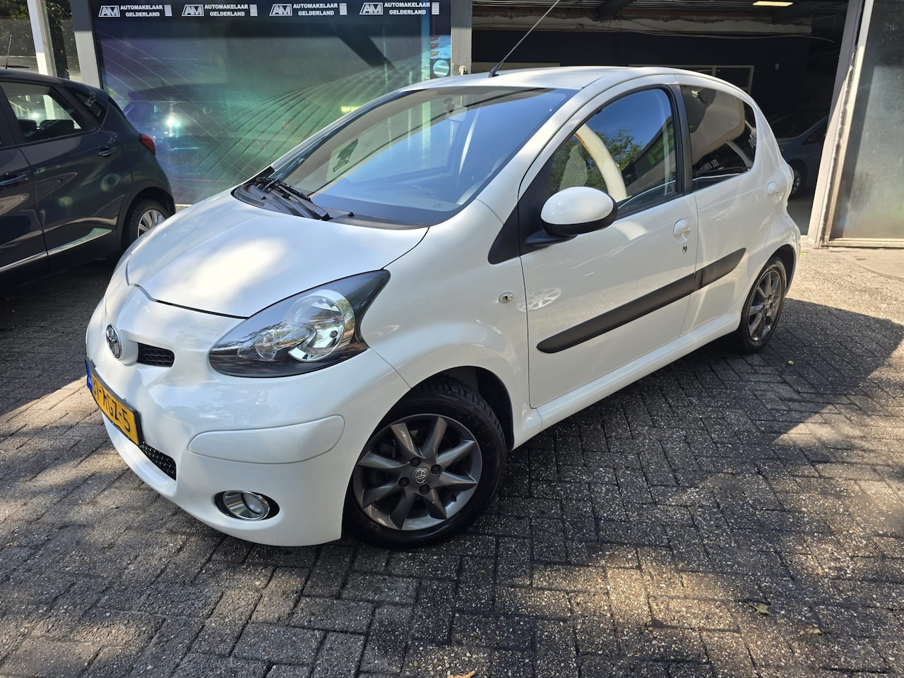 Toyota Aygo - 1.0-12V Dynamic Navigator | AUTOMAAT | 2E EIGENAAR | 3/6 OF 12MND GARANTIE | AIRCO | LMV | - AutoWereld.nl