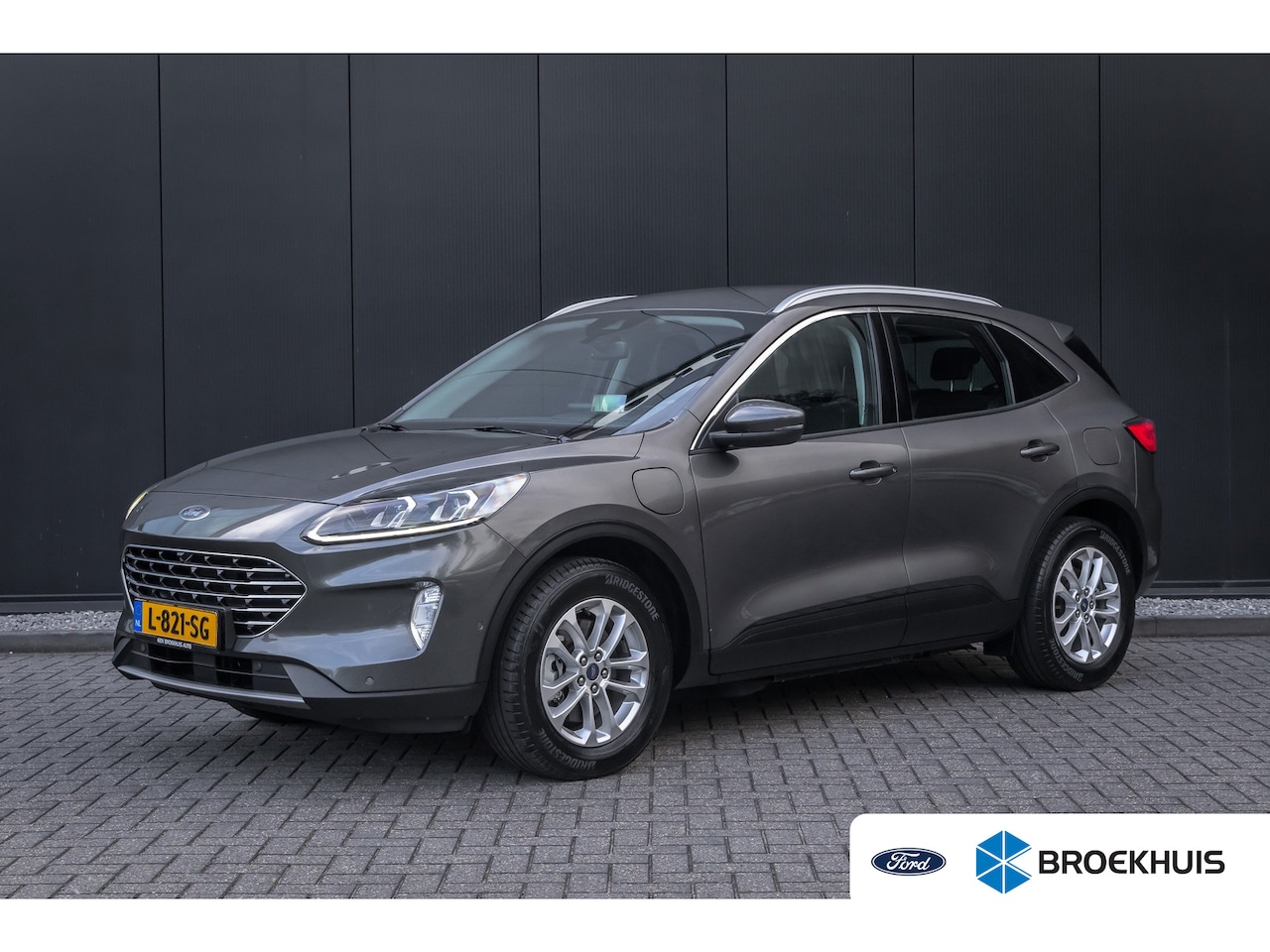 Ford Kuga - 2.5 PHEV Titanium | 100% dealer o.h. | Trekhaak | Adaptieve cruise | Standkachel | Parkeer - AutoWereld.nl