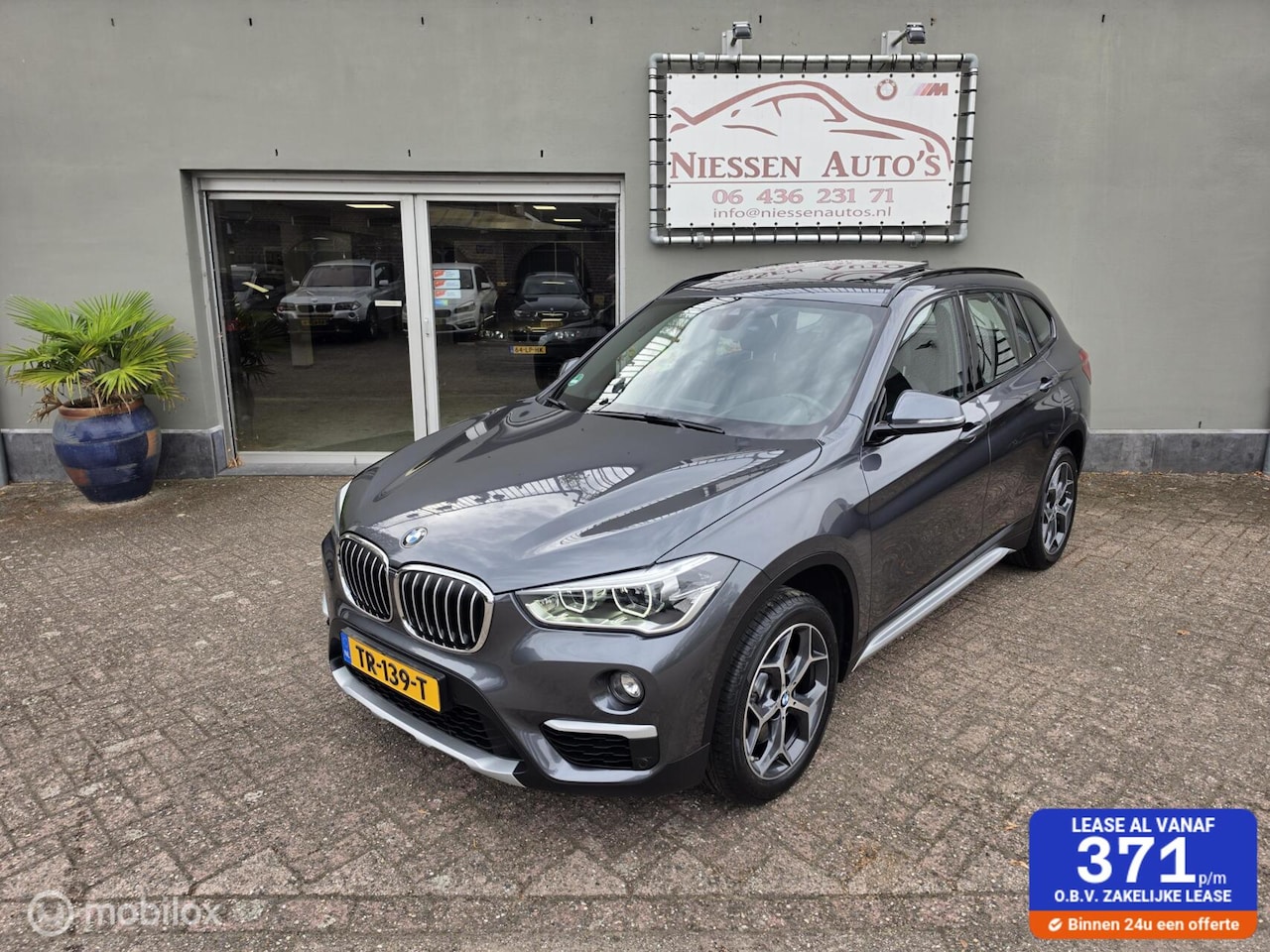 BMW X1 - sDrive20i Orange Edition HUD/Pano/Leder/LED/Camera - AutoWereld.nl
