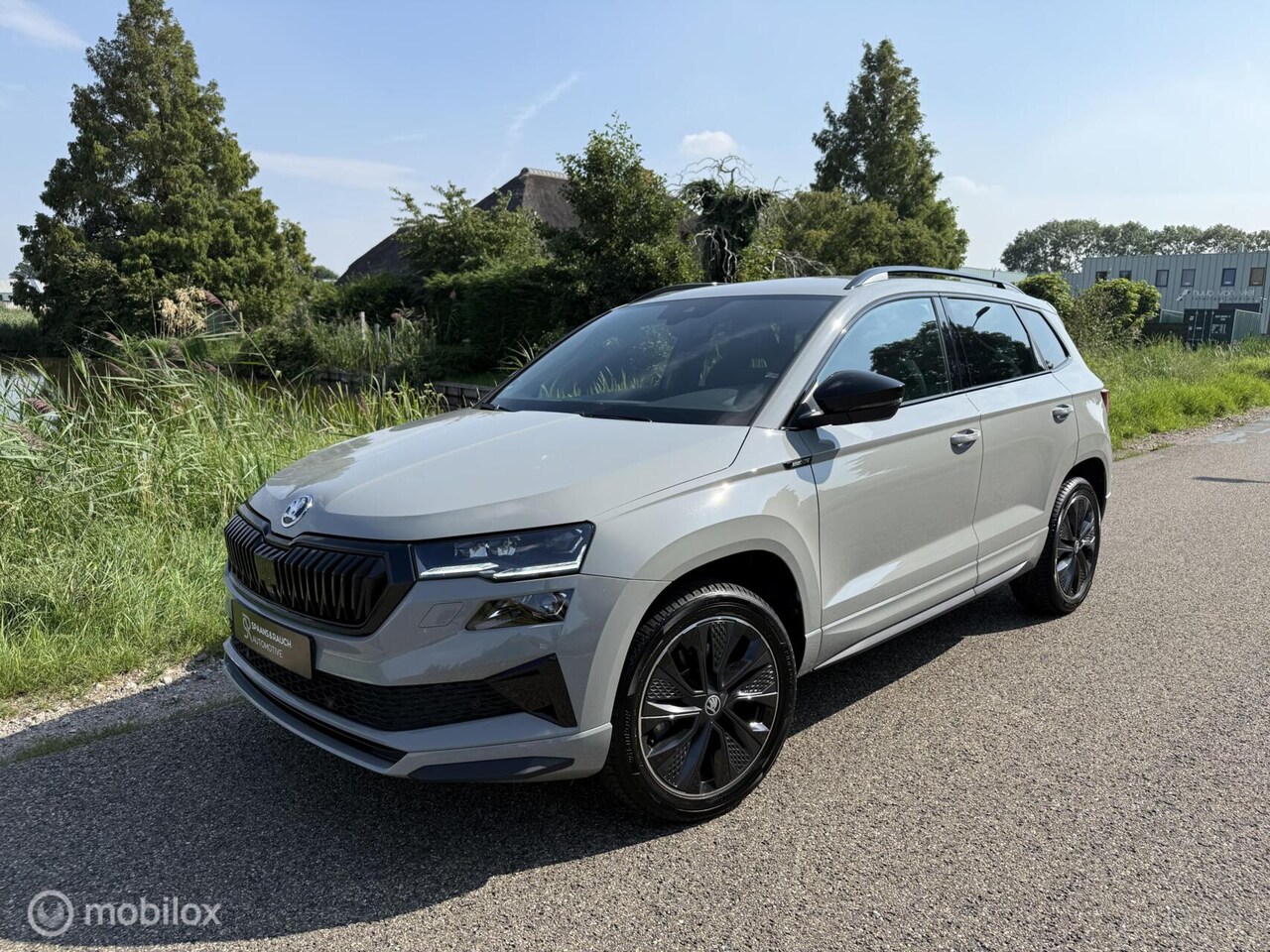 Skoda Karoq - 1.5 TSI ACT Sportline / Canton / Cam / Sfeer - AutoWereld.nl