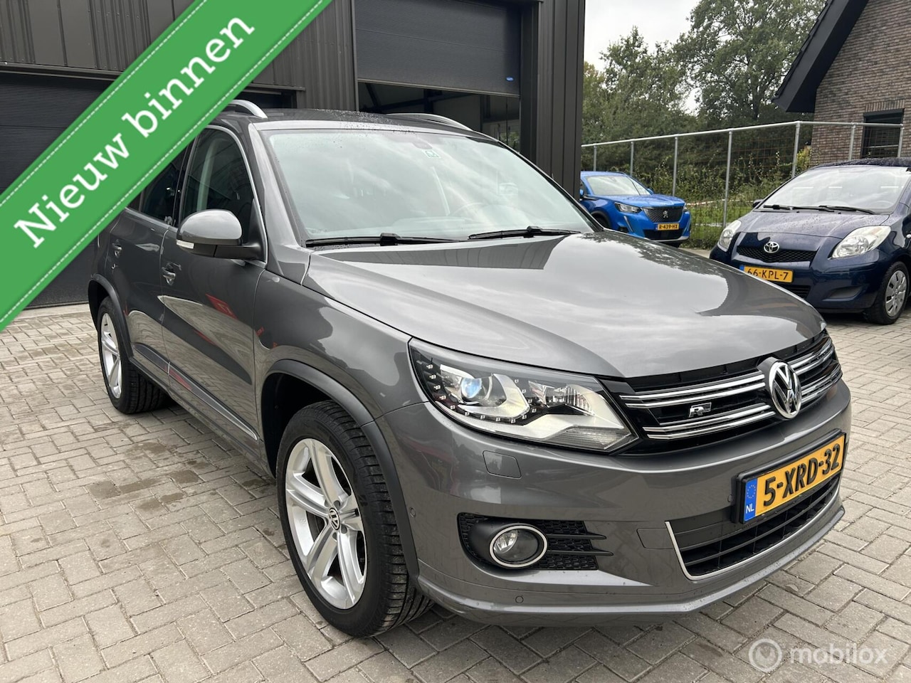 Volkswagen Tiguan - 1.4 TSI R-Line Edition Dealer Ond 1e Eig - AutoWereld.nl