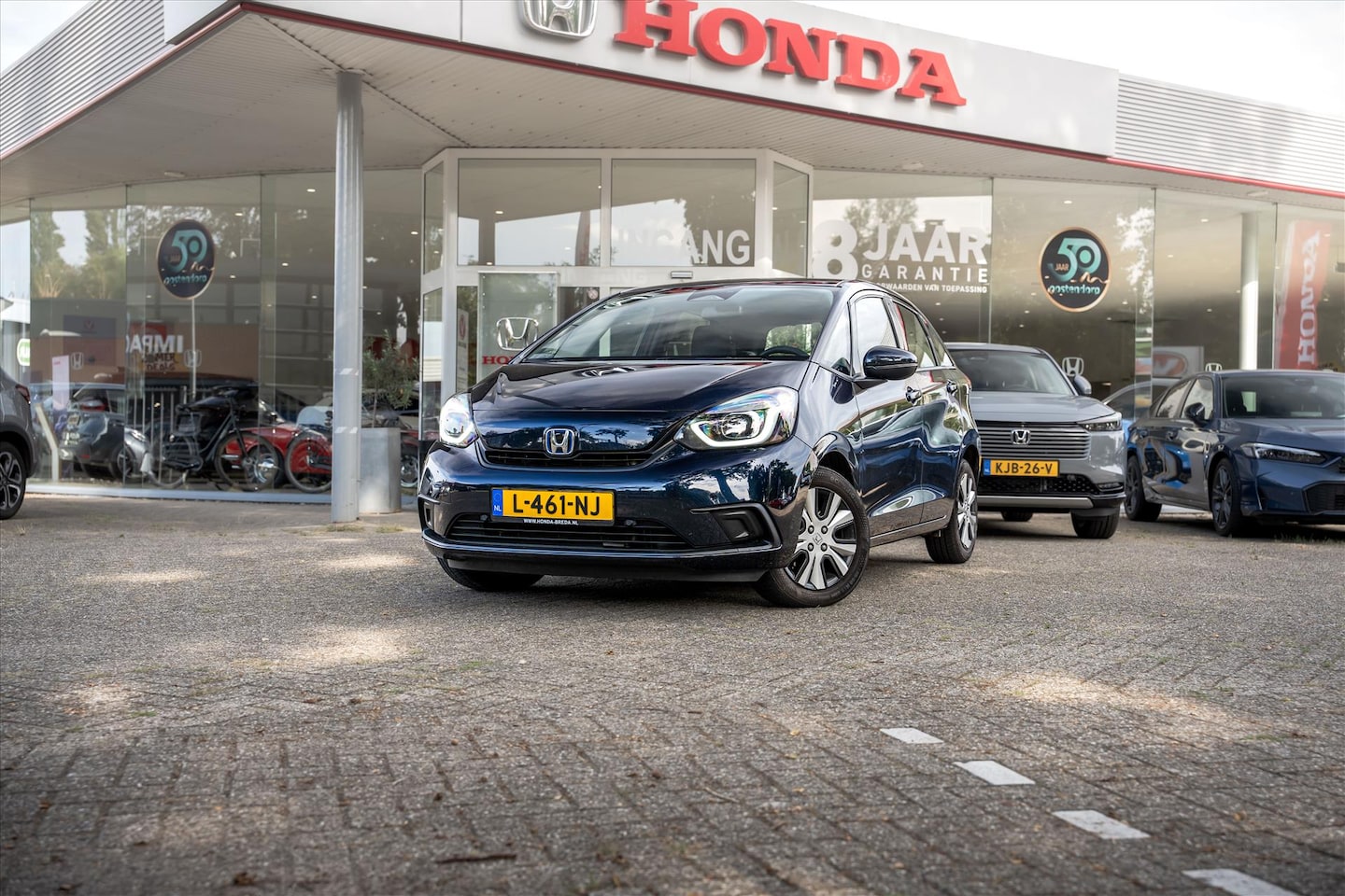 Honda Jazz - 1.5 Full Hybrid Comfort | NL auto | Volledig dealeronderhouden | Afneembare trekhaak | PDC - AutoWereld.nl
