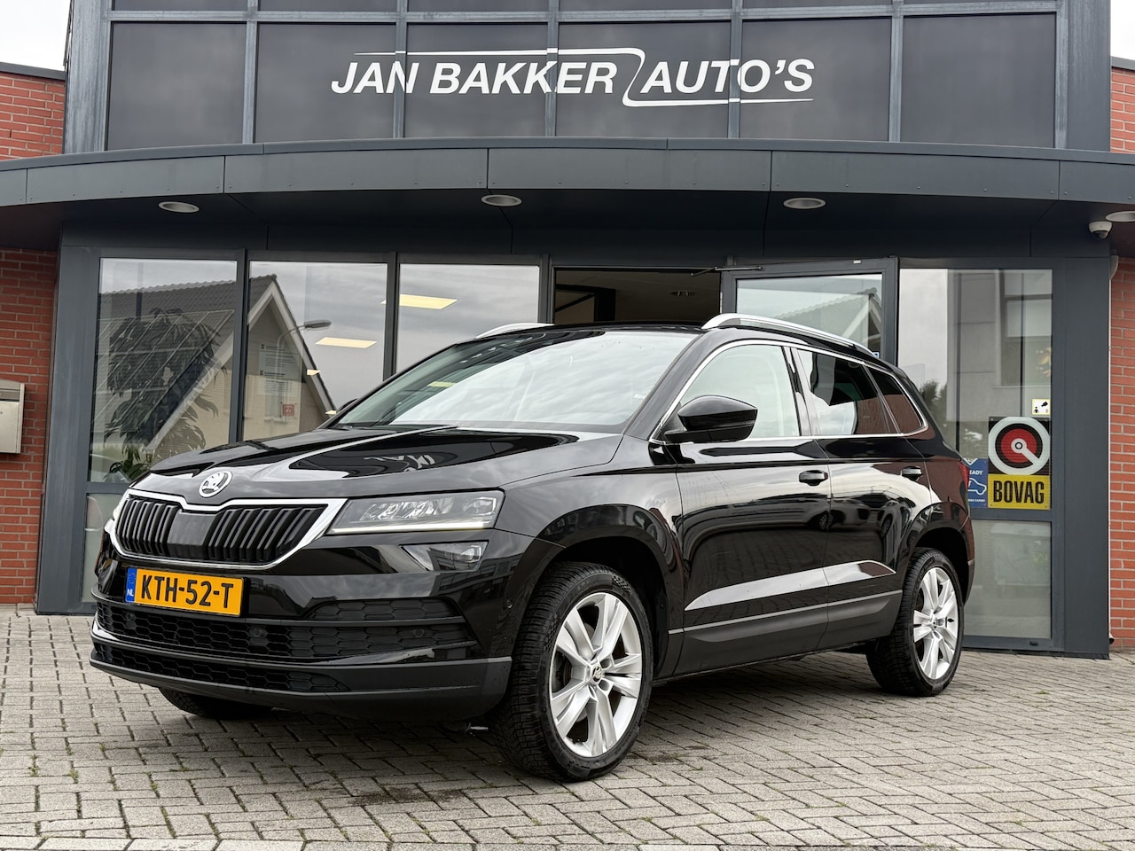 Skoda Karoq - 1.5 TSI ACT Ambition Business ✅ CarPlay ✅ Elec.Trekhaak ✅ Climate  ✅ Stoelverwarming ✅ - AutoWereld.nl