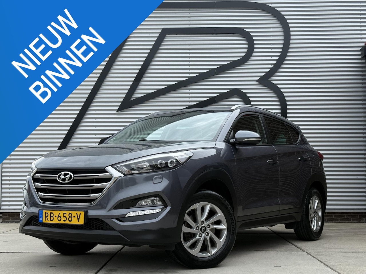 Hyundai Tucson - 1.6 GDi Comfort 1e Eigenaar|Navi|Camera|Clima|Stoelverwarming|Cruise|Trekhaak|Leder|6-bak| - AutoWereld.nl
