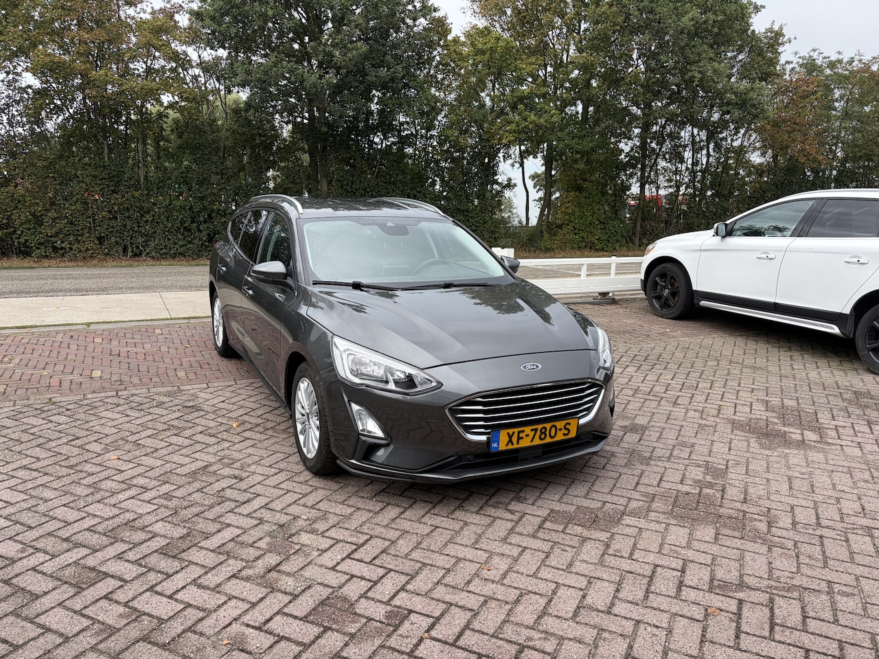 Ford Focus Wagon - 1.0 EcoBoost Titanium Business TREKHAAK WINTER PACK PDC CARPLAY - AutoWereld.nl
