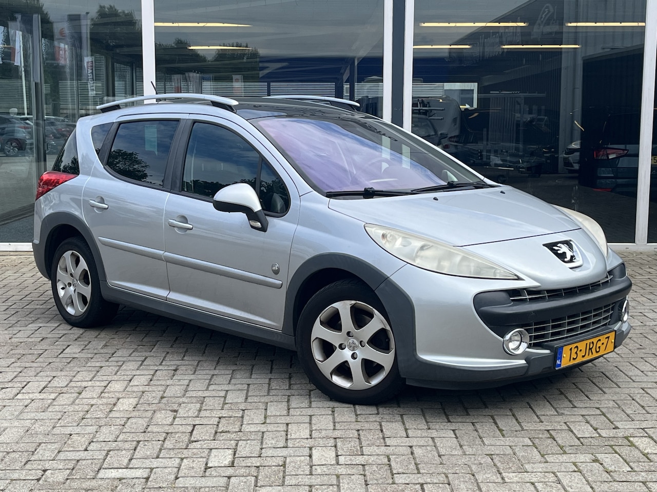 Peugeot 207 SW Outdoor - 1.6 VTi Sublime / Half Leer / Cruise / Airco / Lmv - AutoWereld.nl