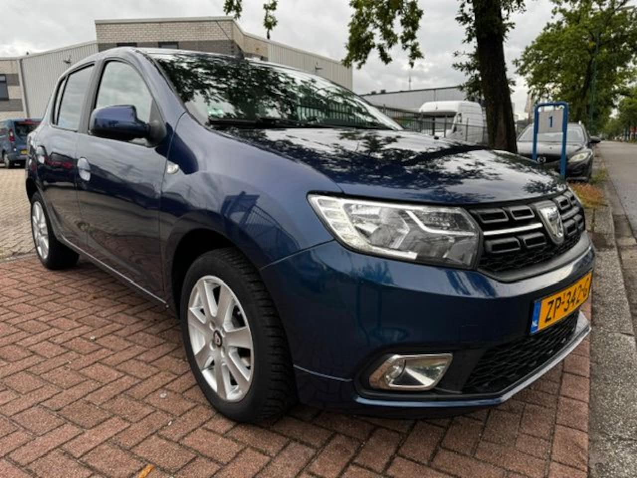 Dacia Sandero - 1.0 SCe 5deurs Laureate 134.000km Airco,Navigatie,,Leder,Camera - AutoWereld.nl