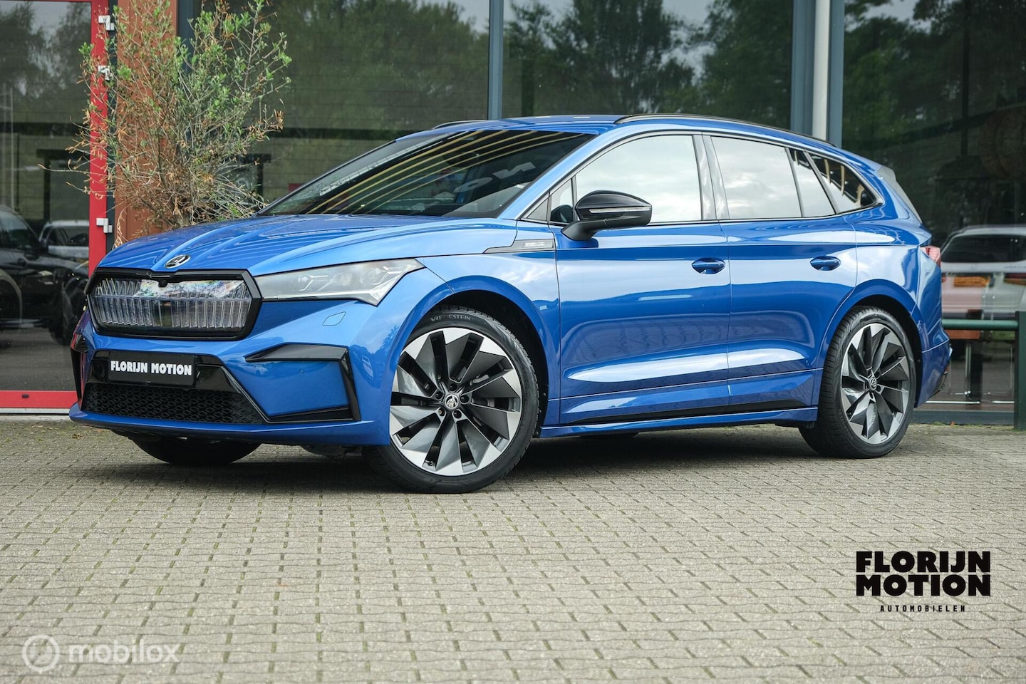 Skoda Enyaq iV - 80 Sportline | Chrystal lights and face | ACC | Elec. Trekhaak | Racing Blue | 90% SOH | C - AutoWereld.nl