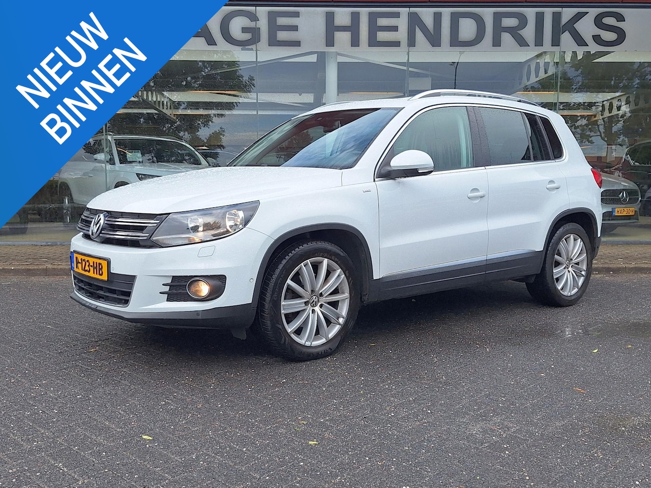 Volkswagen Tiguan - 1.4 TSI R Line CUP | Trekhaak 1800kg | Pano Dak | Camera | Navi | Climate | CC | - AutoWereld.nl
