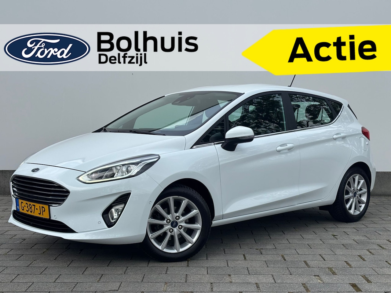 Ford Fiesta - EcoBoost 100pk Titanium | Verwarmde voorruit | Camera | Navi | Cruise | Clima | Apple Carp - AutoWereld.nl