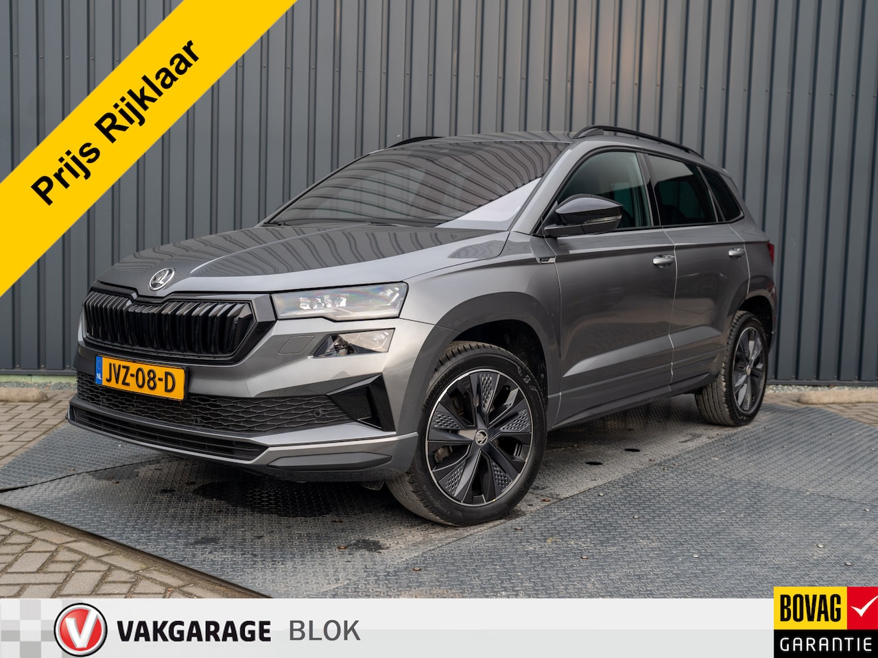 Skoda Karoq - 1.5 TSI ACT Sportline Business | Leder | Camera | Adapt. Cruise control | Stoel & Stuur ve - AutoWereld.nl