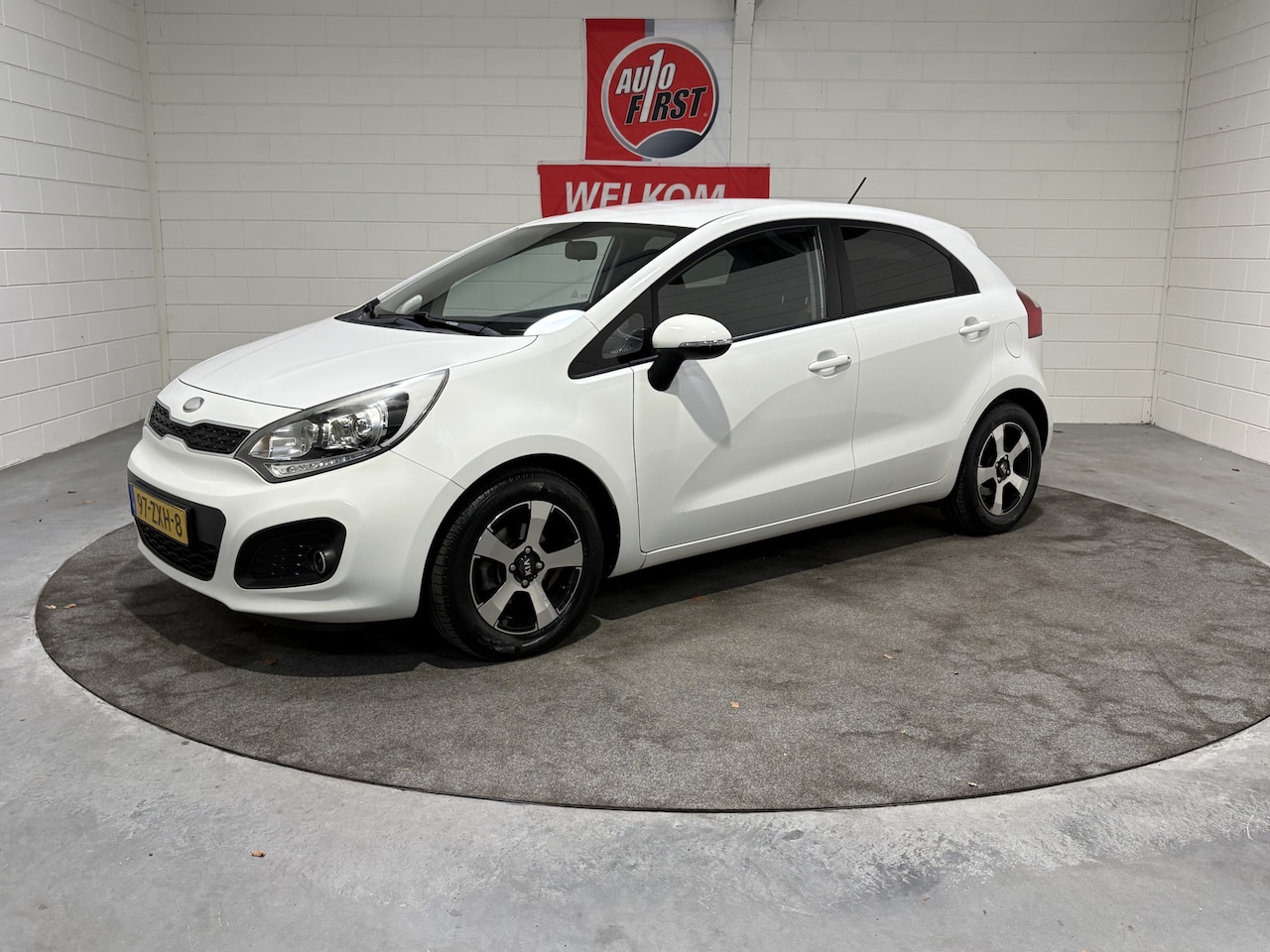 Kia Rio - 1.2 CVVT Design Edition 1.2 CVVT Design Edition, Volledig dealer onderhouden, Airco, Cruise, Afn trekhaak Lichtmet - AutoWereld.nl