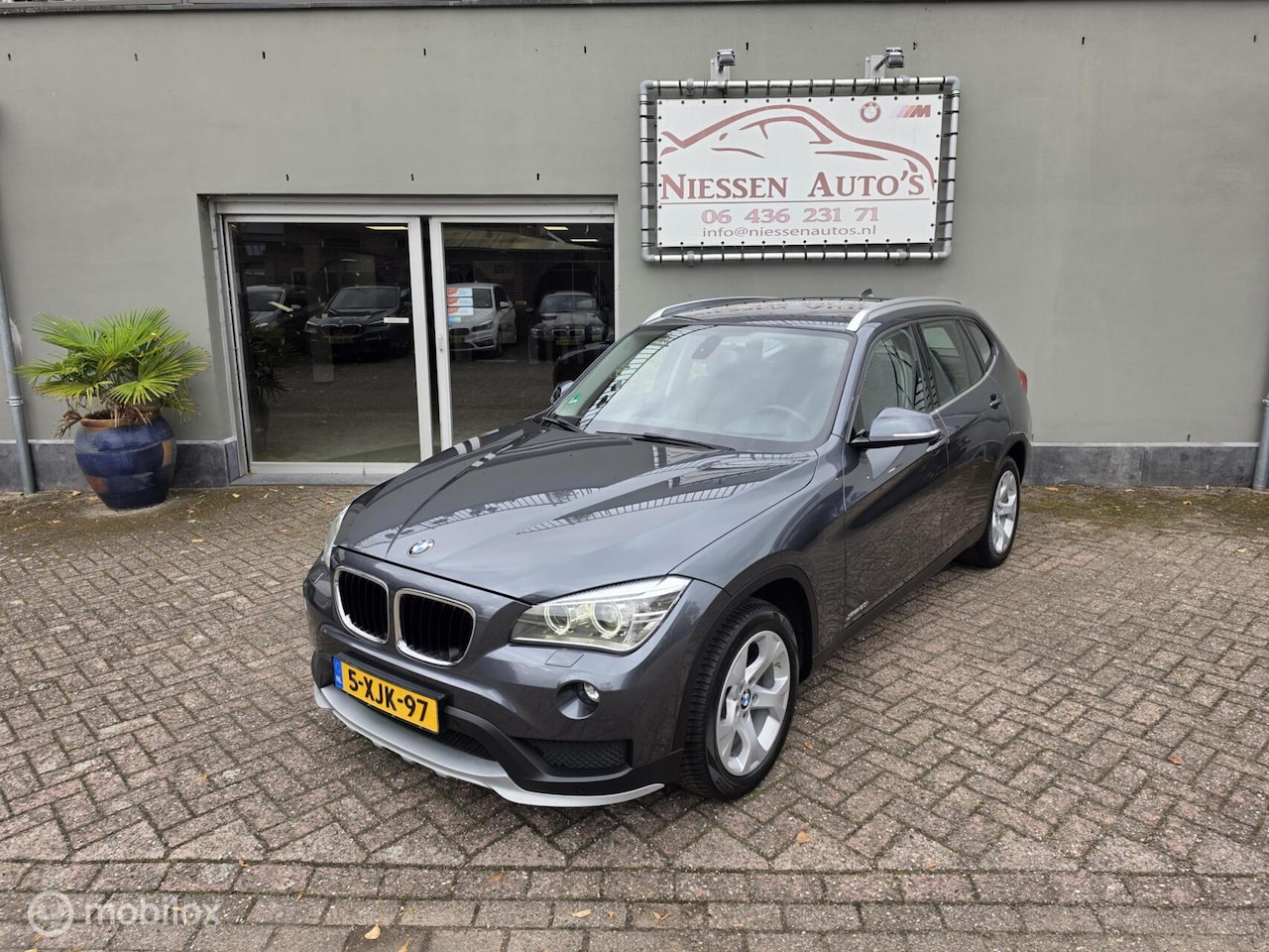 BMW X1 - E84 xDrive20i High Executive Leder/Navi/Nwe Ketting - AutoWereld.nl