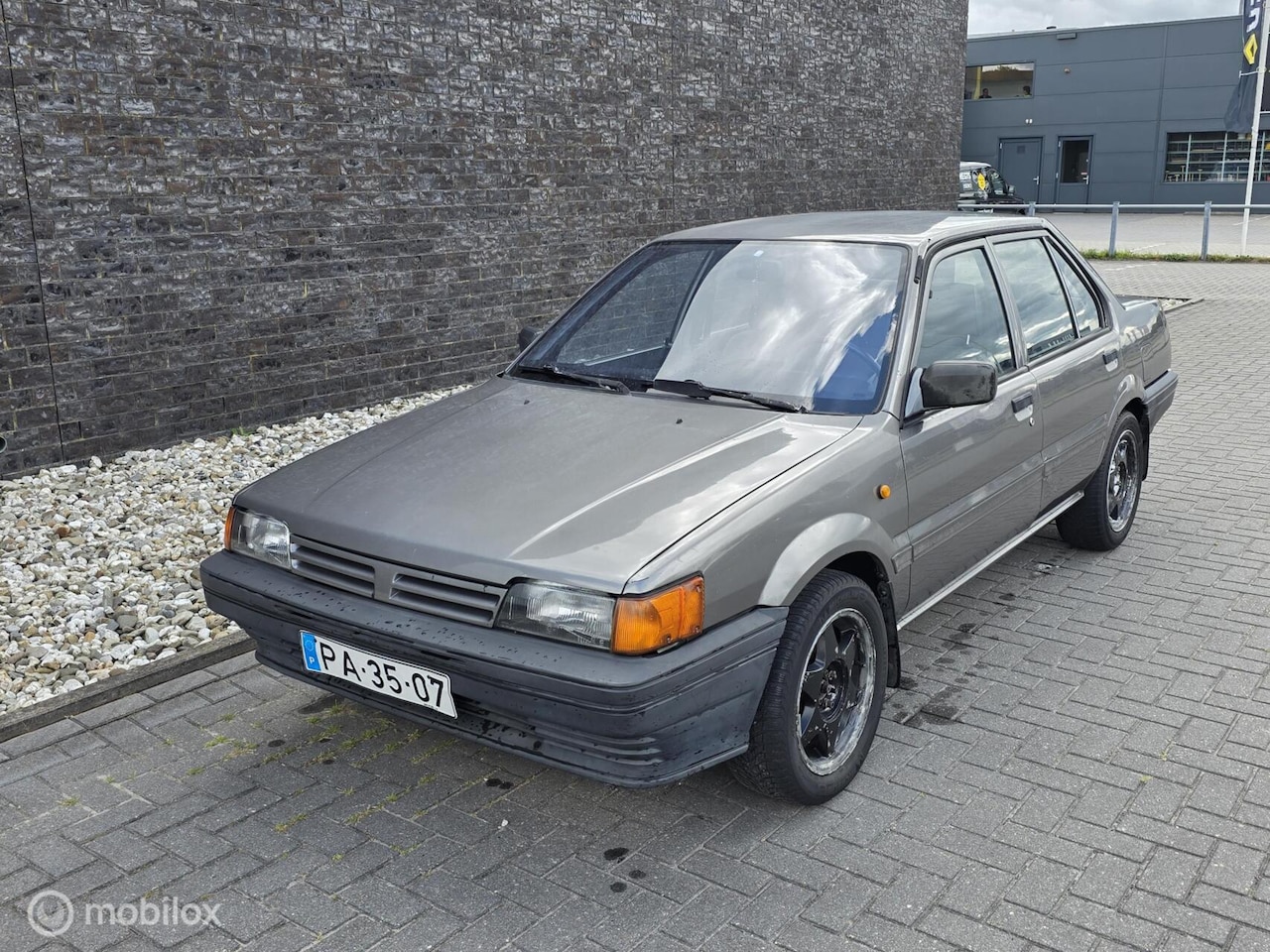 Nissan Sunny - 1.3 SLX 1988 - Oldtimer - Portugees kenteken - AutoWereld.nl