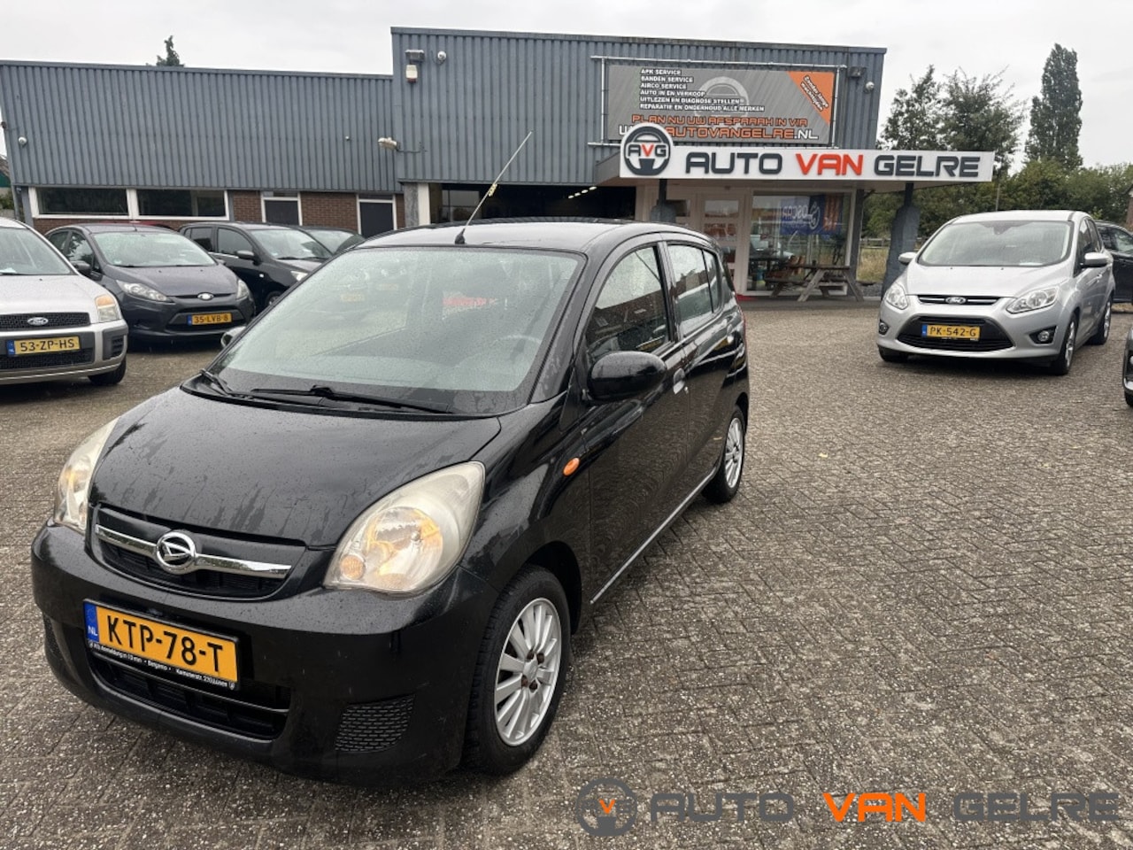 Daihatsu Cuore - 1.0 Premium 5Drs Airco Zwart Zuinige Auto - AutoWereld.nl