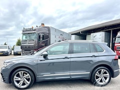 Volkswagen Tiguan - 1.5 TSI 150pk aut + f1 R-Line - pano - virtual - stuurverw - leer + stoelverw - line + fro