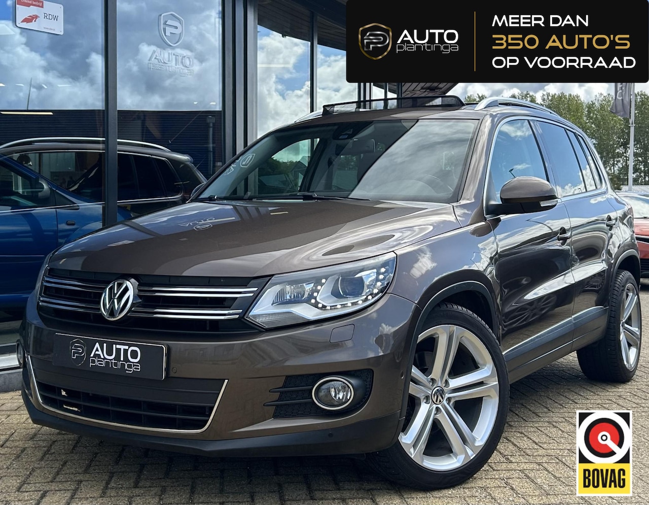 Volkswagen Tiguan - 2.0 TSI Sport&Style 4Motion 179PK | AUTOMAAT | NL AUTO | PANO | Wegklapbare Trekhaak | Sto - AutoWereld.nl