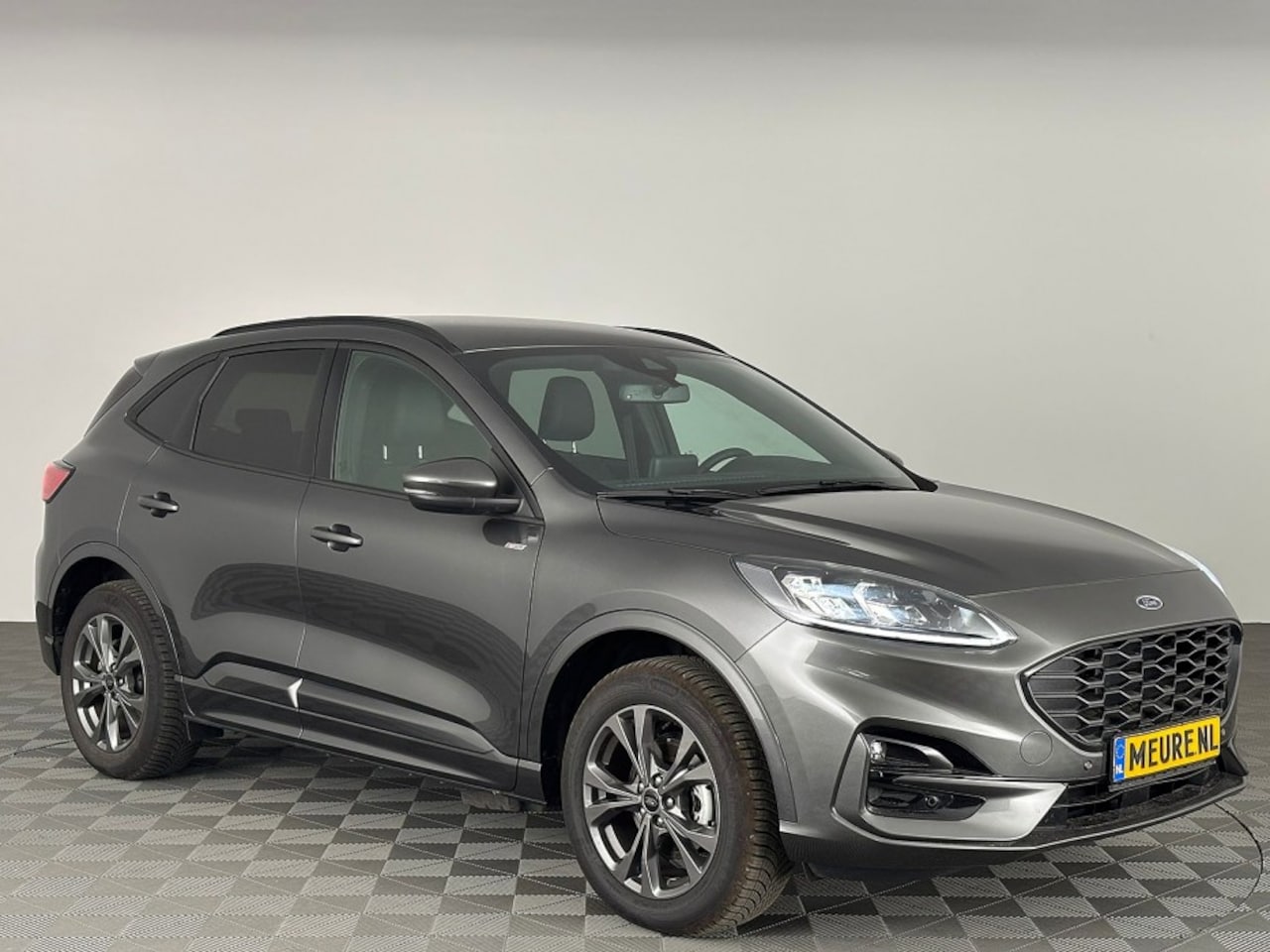 Ford Kuga - 2.5 PHEV ST-Line X | B&O | Winter PACK | NAVI | ECC | EL. Stoel - AutoWereld.nl