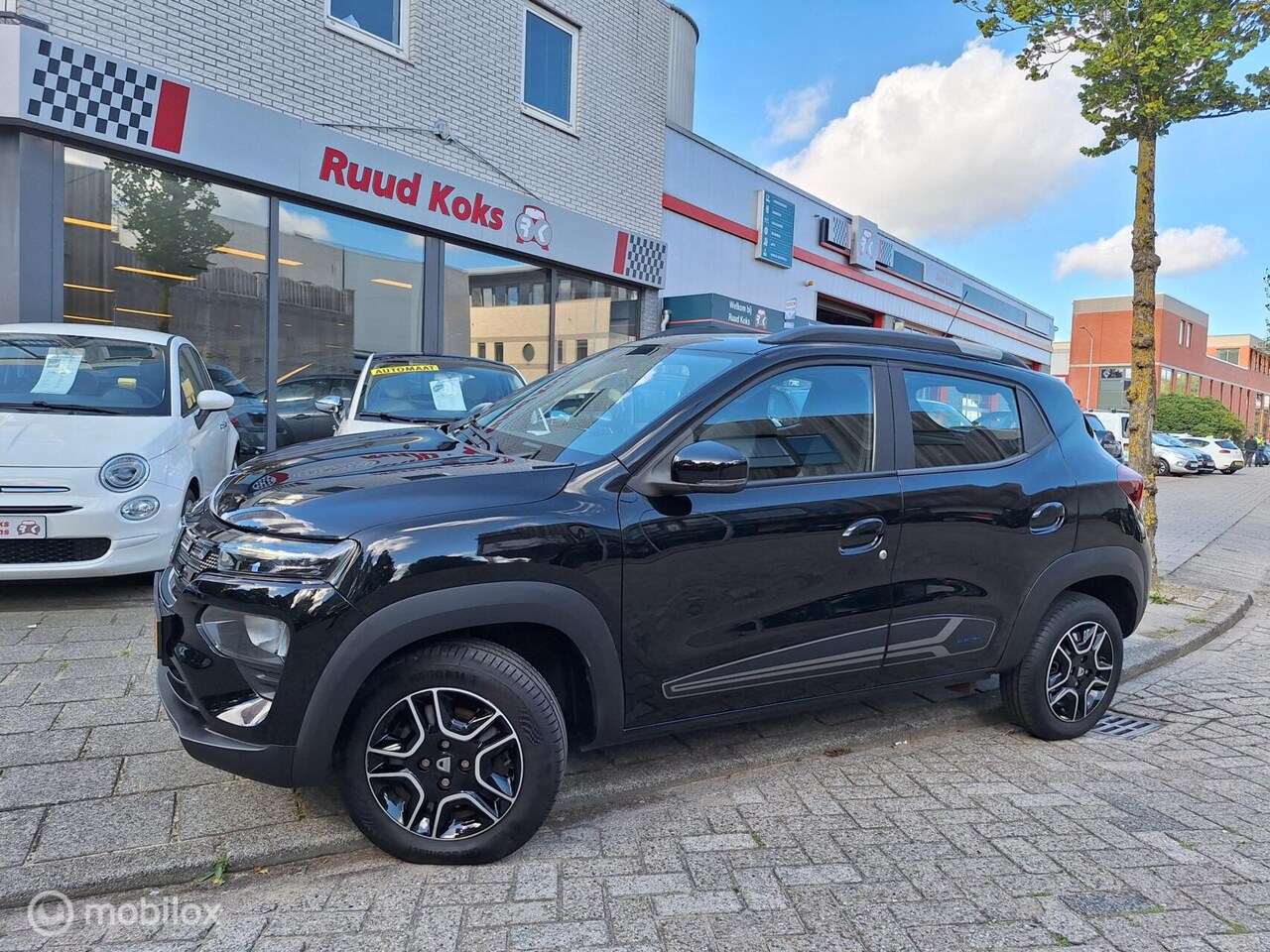 Dacia Spring - COMFORT PLUS (ORANGE PACK) 27 kWh • 1E EIGENAAR • - AutoWereld.nl