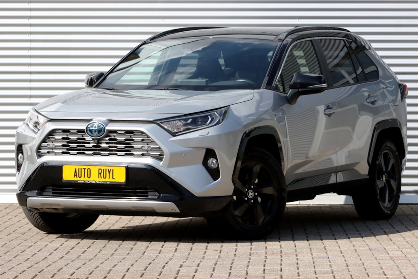 Toyota RAV4 - 2.5 Hybrid AWD Bi-Tone Panoram / 360Gr. Camera - AutoWereld.nl