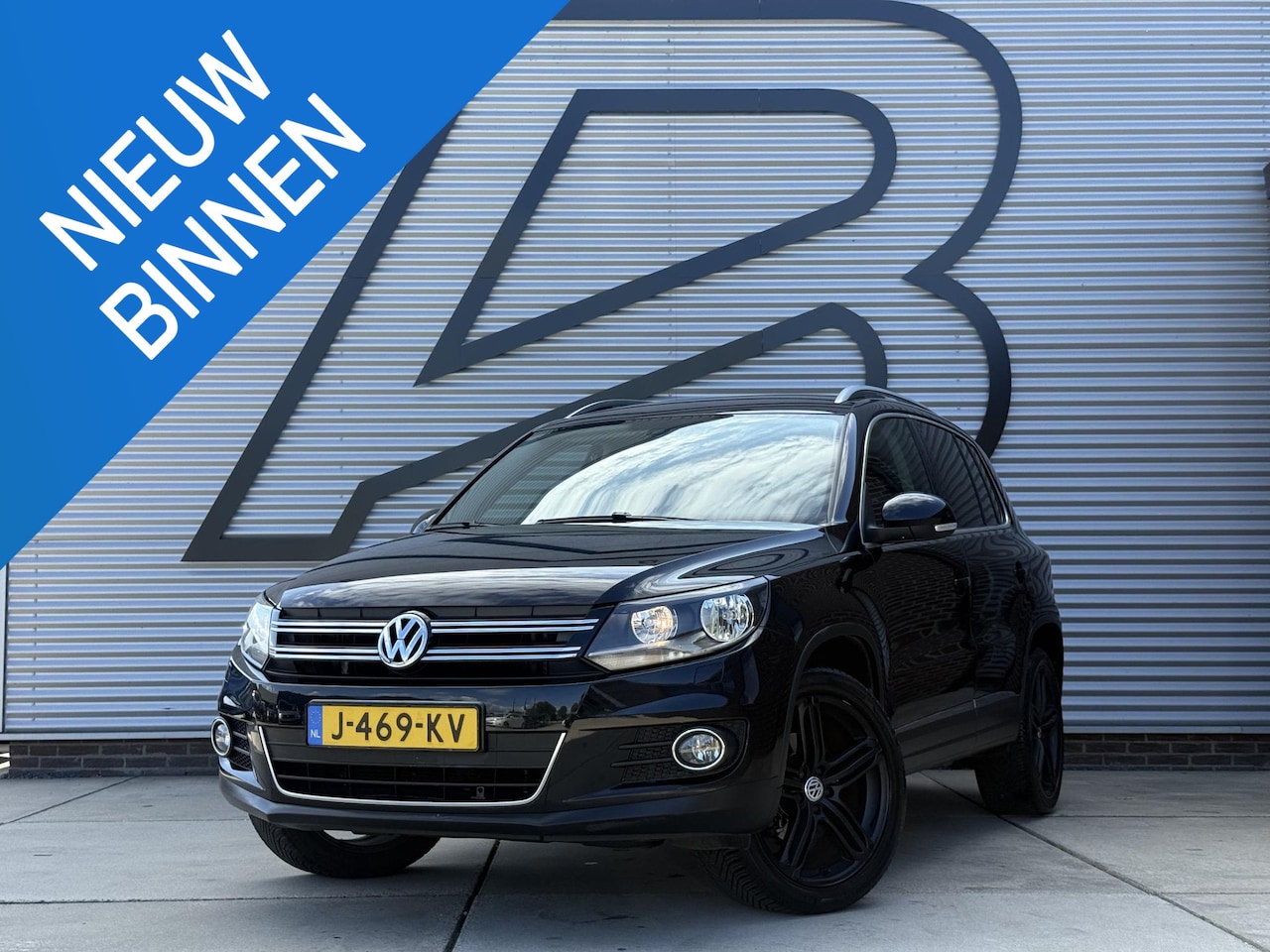 Volkswagen Tiguan - 2.0 TSI Sport&Style 4Motion 2e Eigenaar|Navi|Clima|Cruise|PDC|Trekhaak|Stoelverwarming|Nie - AutoWereld.nl