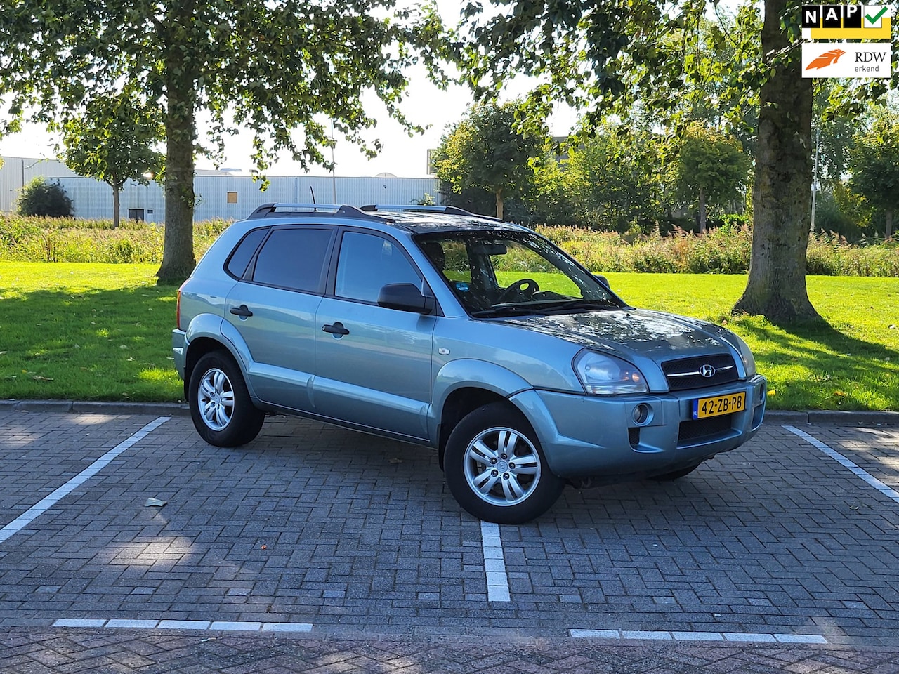 Hyundai Tucson - 2.0i Dynamic / Airco / Nap / Cruise control / Nieuwe Apk / Trekhaak - AutoWereld.nl