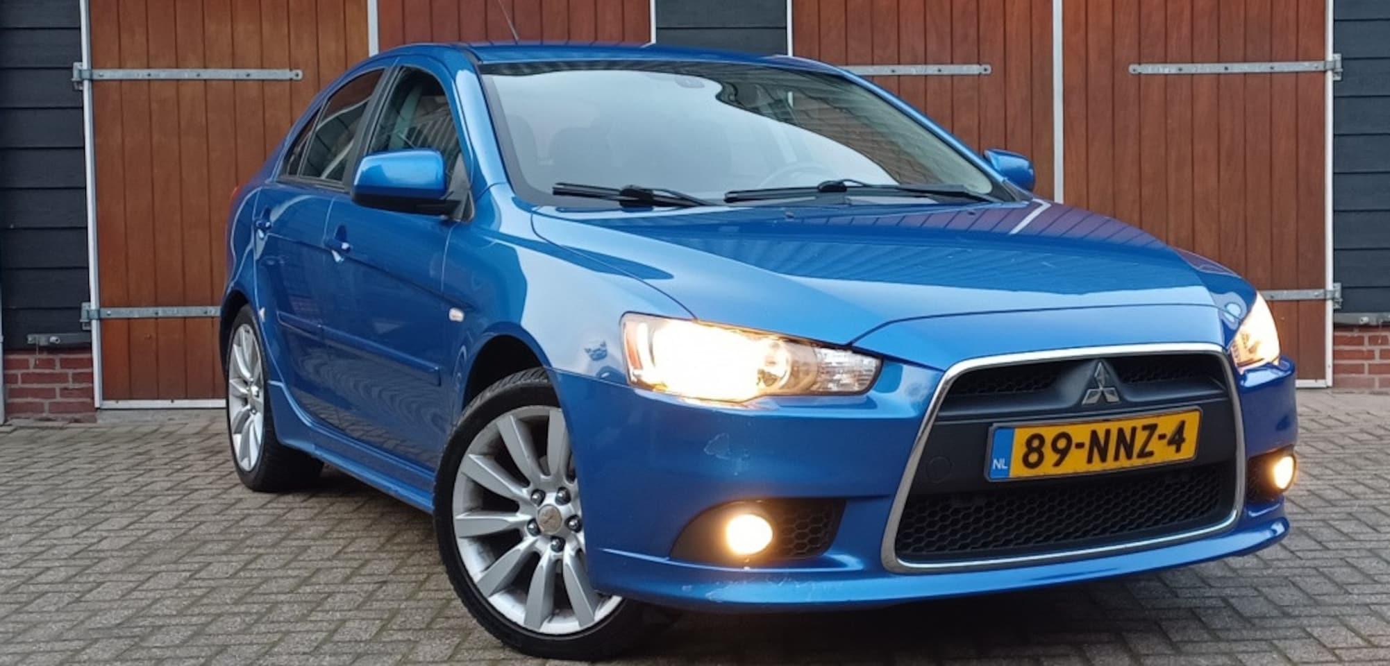 Mitsubishi Lancer Sportback - 1.8 Intense | Bluetooth | Trekhaak | NAP | Parkeersensoren | All seasonbanden - AutoWereld.nl