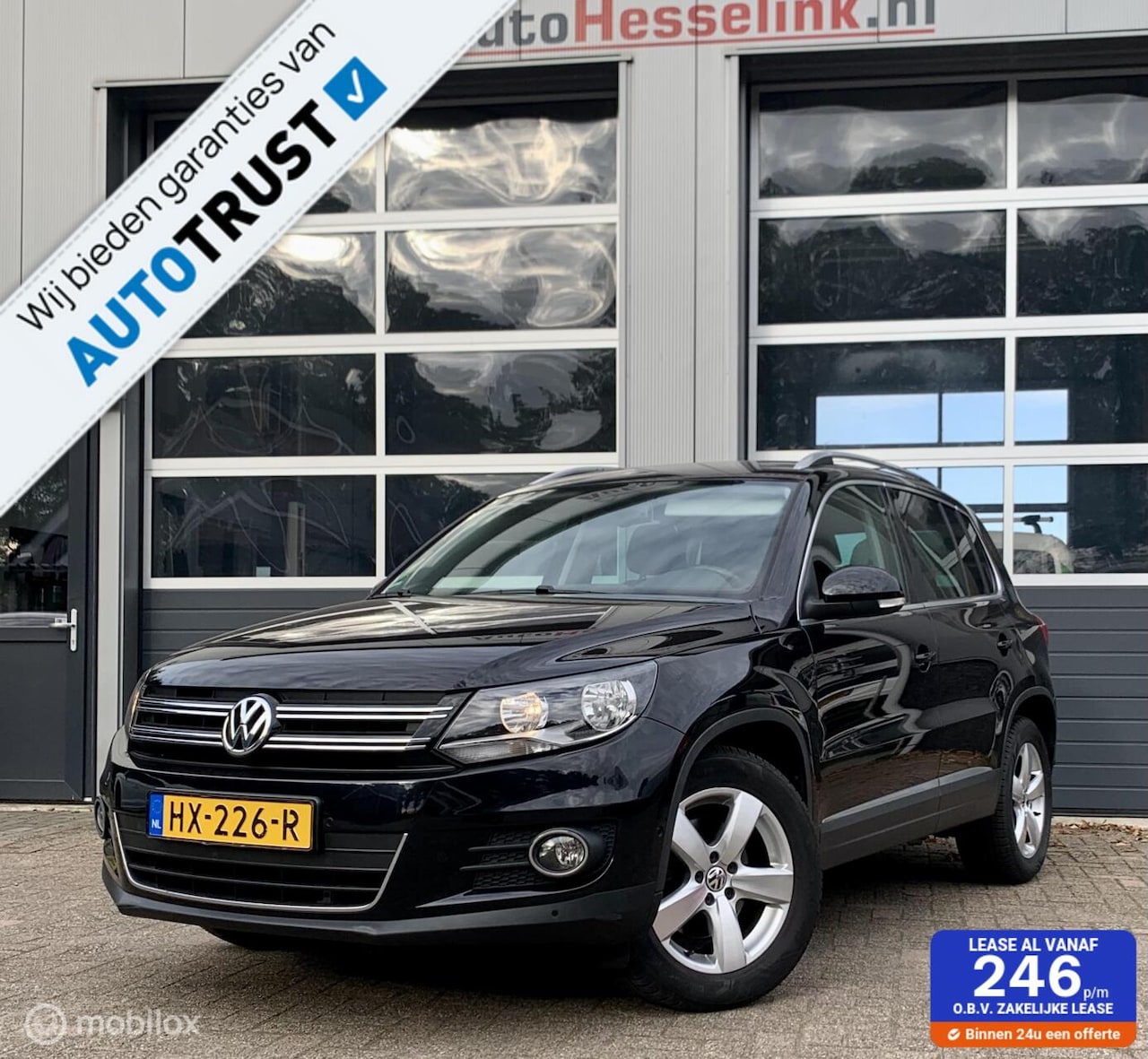 Volkswagen Tiguan - 1.4 TSI Sport & Styl |TREKHAAK|NAV|PDC - AutoWereld.nl