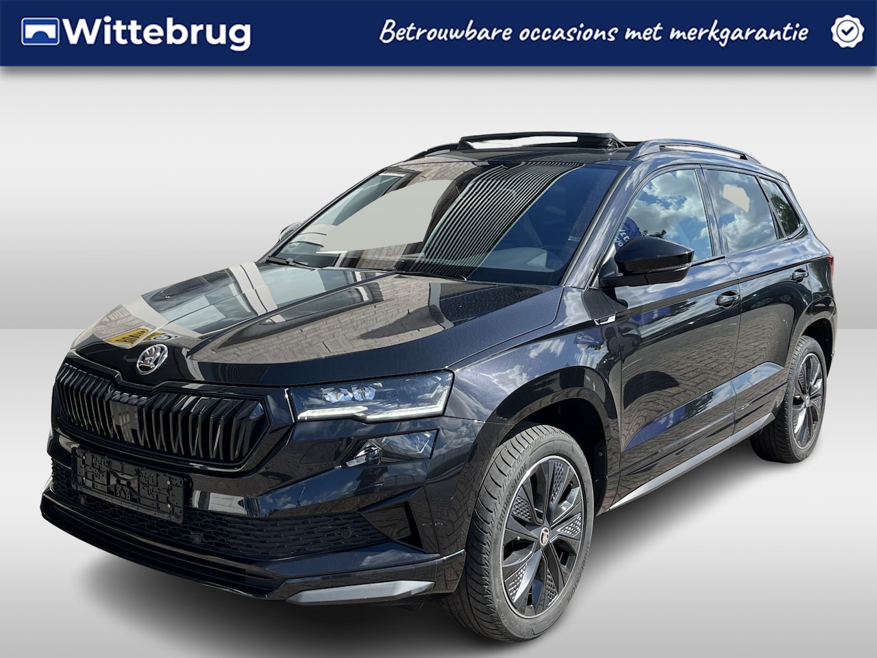 Skoda Karoq - 1.5 TSI ACT Sportline Business / AUTOMAAT/ PANO/ CRUISE/ DIGITAL DASH/ NAVI/ SMARTLINK/ ST - AutoWereld.nl