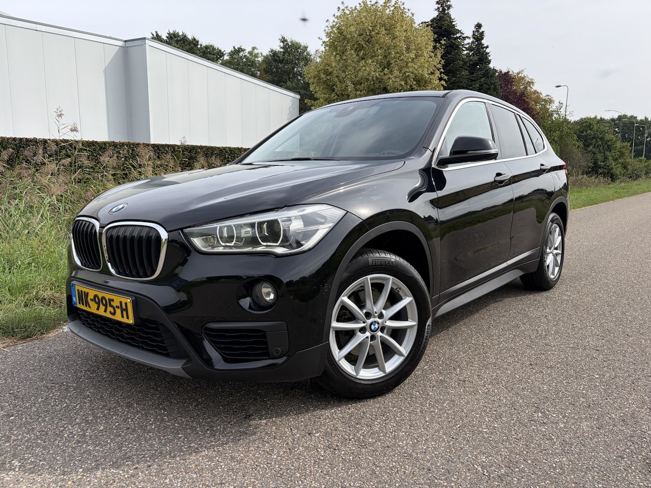 BMW X1 - sDrive18i Centennial Executive / NAVI / CRUISE / AIRCO / TREKHAAK / 101dkm! NAP! - AutoWereld.nl
