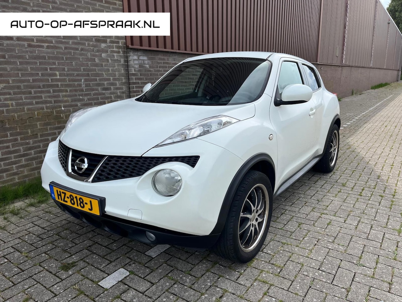 Nissan Juke - 1.6 Navi Clima Camera Cruise C. APK NAP - AutoWereld.nl