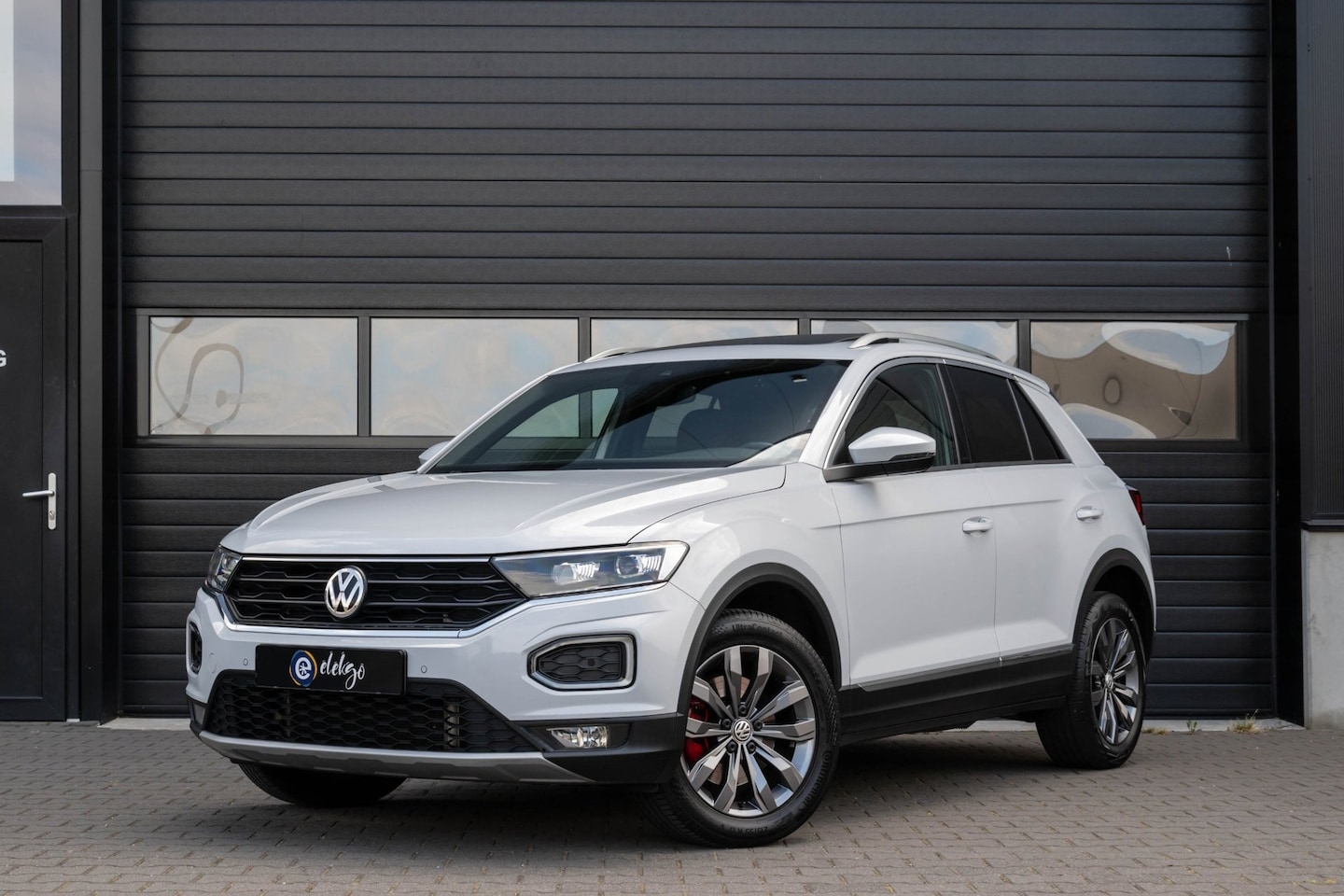 Volkswagen T-Roc - 2.0 TSI 4Motion Sport|Pano|Winterpakket|Keyless|Cam| - AutoWereld.nl