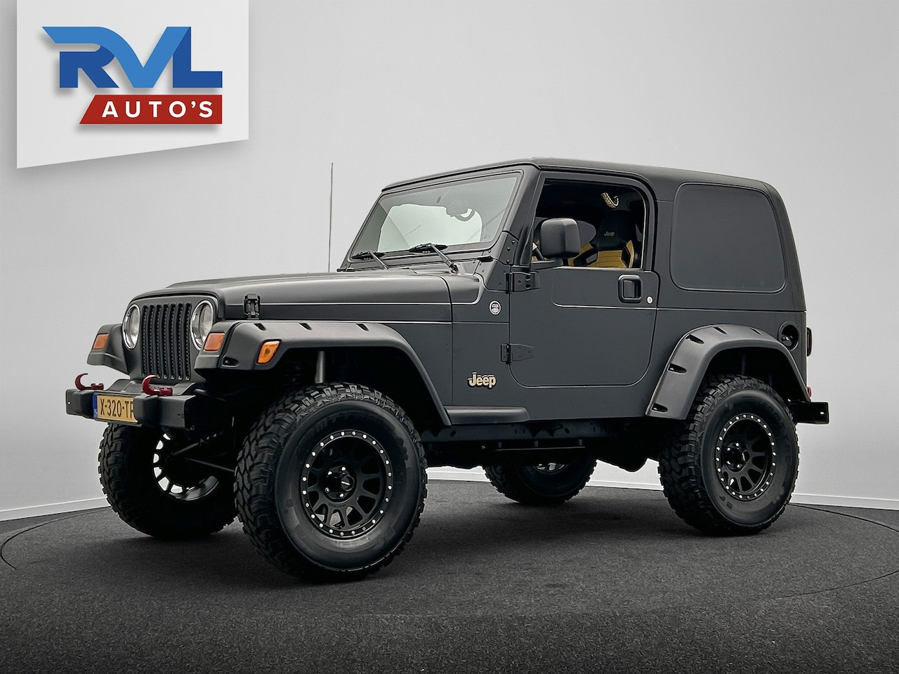 Jeep Wrangler - 4.0i Hardtop TJ Automaat Airco Apple Car play Matte zwarte Wrap - AutoWereld.nl