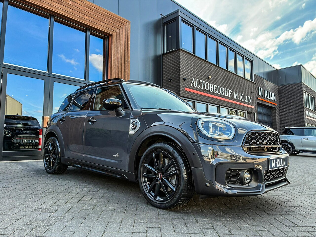 MINI Countryman - Mini 2.0 Cooper S E ALL4 John Cooper Works hybrid aut 220pk/leer/pano/camera/uniek - AutoWereld.nl
