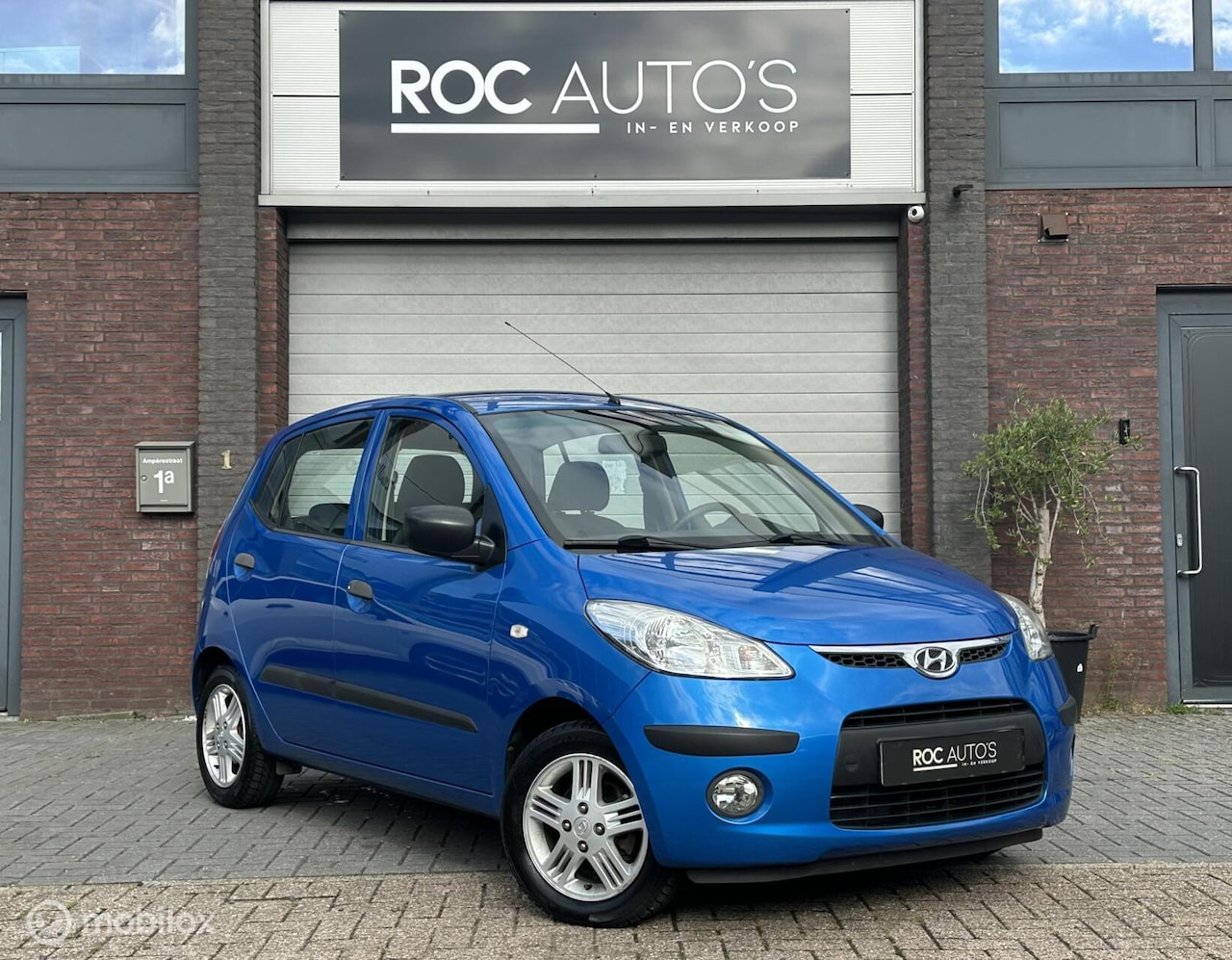 Hyundai i10 - 1.1 Active Orange Babies | Airco | Cruise | APK - AutoWereld.nl