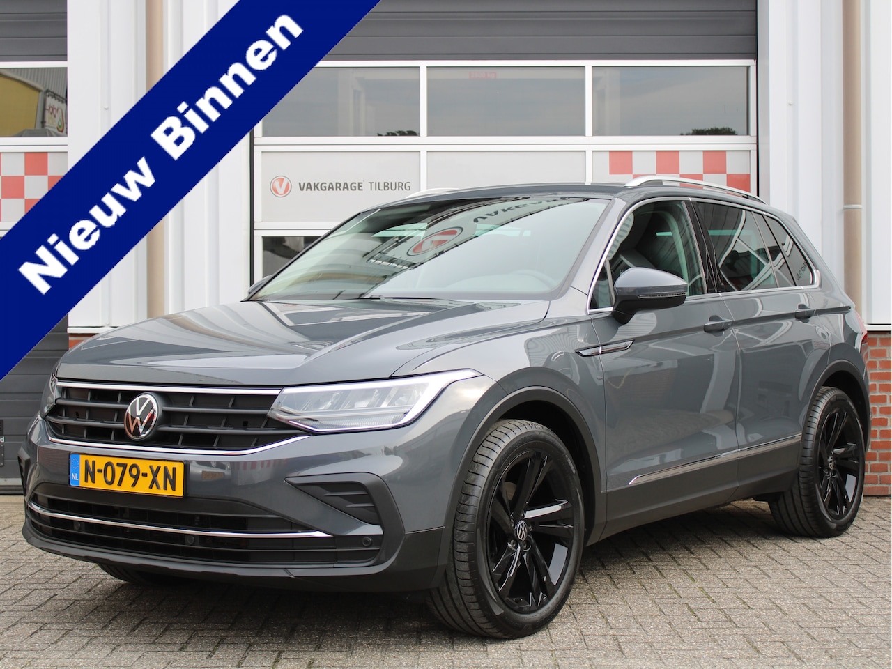 Volkswagen Tiguan - 1.5 TSI Sport Business /NAVI/Camera/19'LM/Keyless/ACC/Carplay/LED/PDC/Keyless/Stuurverwarm - AutoWereld.nl